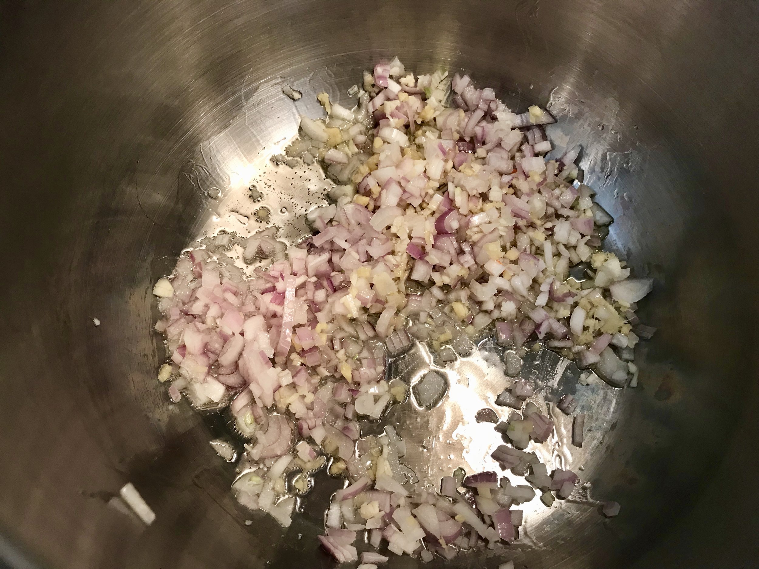 Saute ginger, garlic and shallots for a few minutes, stirring frequently.