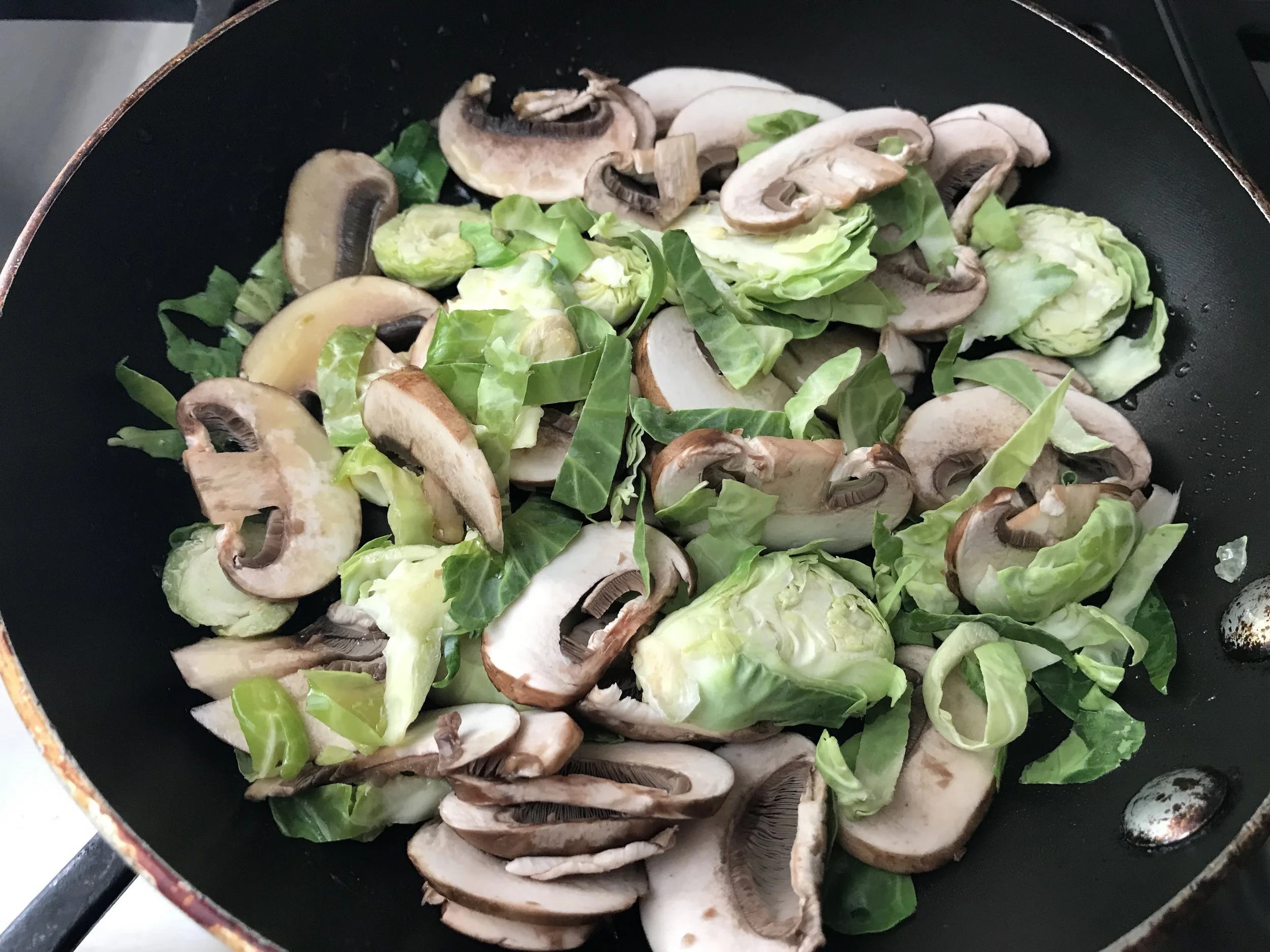 Shaved brussels sprouts from Trader Joes or Gelsons (great convenience item!!) and sliced cremini mushrooms, sautéed until a little browned.