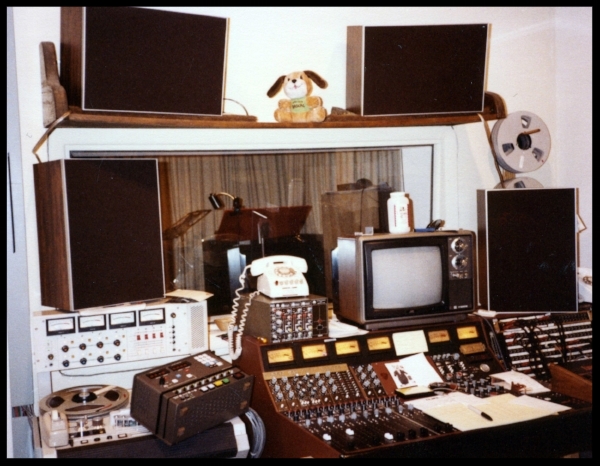 Around 1982 -Sitting on the 4 track machine on the left is the remote for the MCI 8 track which is in the back of the room. There are 2 additional MDM monitors sitting under the speaker shelf, this is not a normal situation but an experiment, most likely during a session with John Klett. That would be the corner of his Linn Drum Machine on the extreme right.