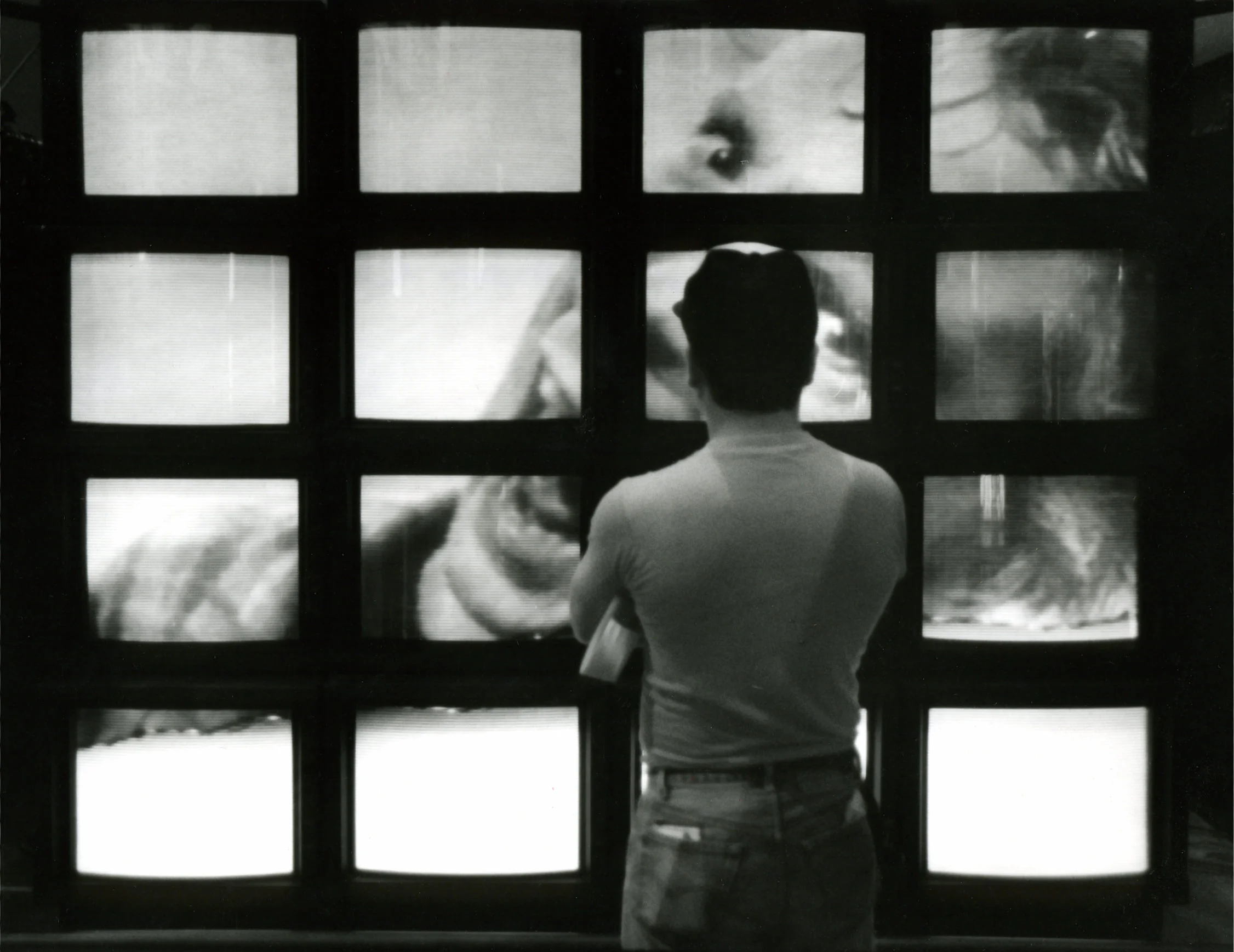 Rubin D. Herrera watches the "breathing" video wall at the MTV Museum of UnNatural History. photo - Carlos Antonio Rios, Houston Chronicle © 1988 From the Houston Chronicle March 25, 1988