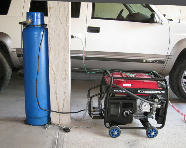 Generator Hooked up to a 30 kg Propane Cylinder: Runs for 28 Hours! Green Wire is a Ground Wire.