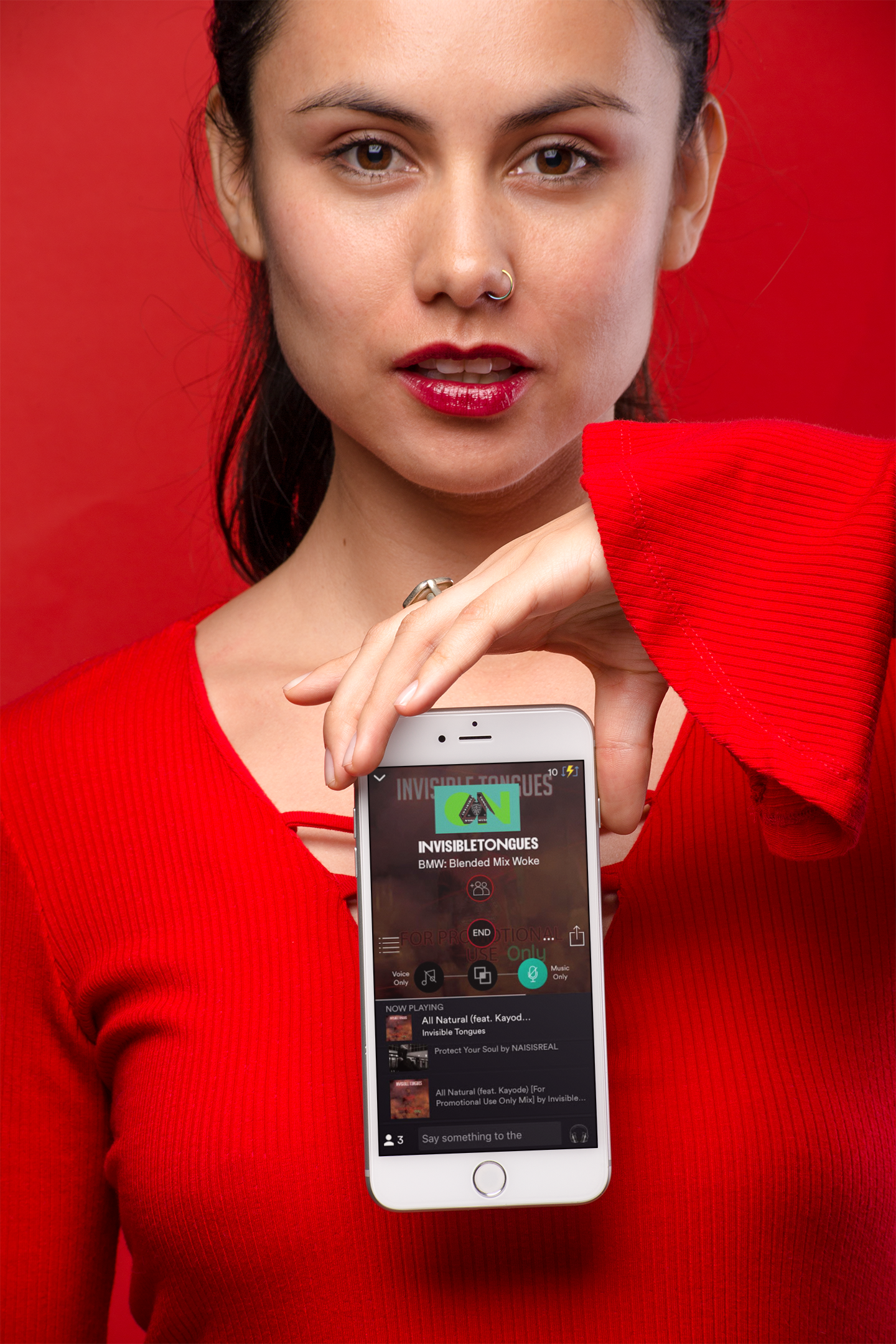 mockup-of-a-woman-holding-IT-silver-iphone-8-wearing-all-red-21966.png