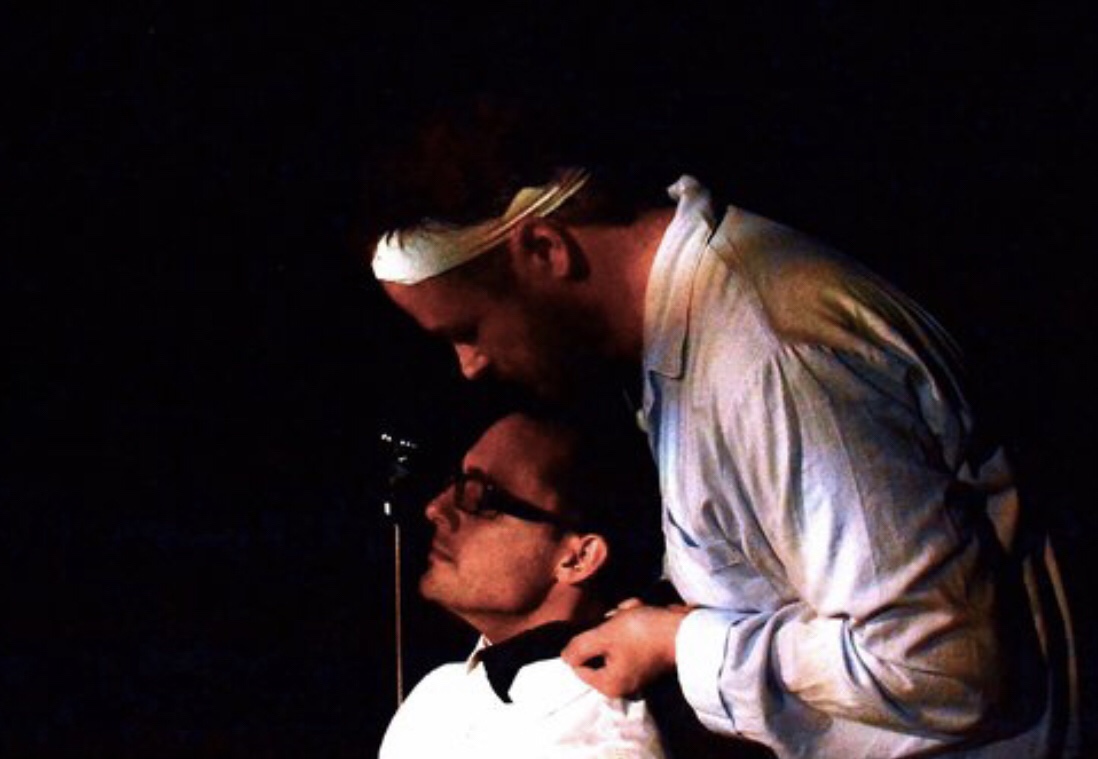 Rich Sargent (seated) as Damien and Neil Higgins as Allen in Left Coast Theatre Company’s production of The Screens , written by Erik Champney and directed by Rich Sargent. San Francisco, CA.
