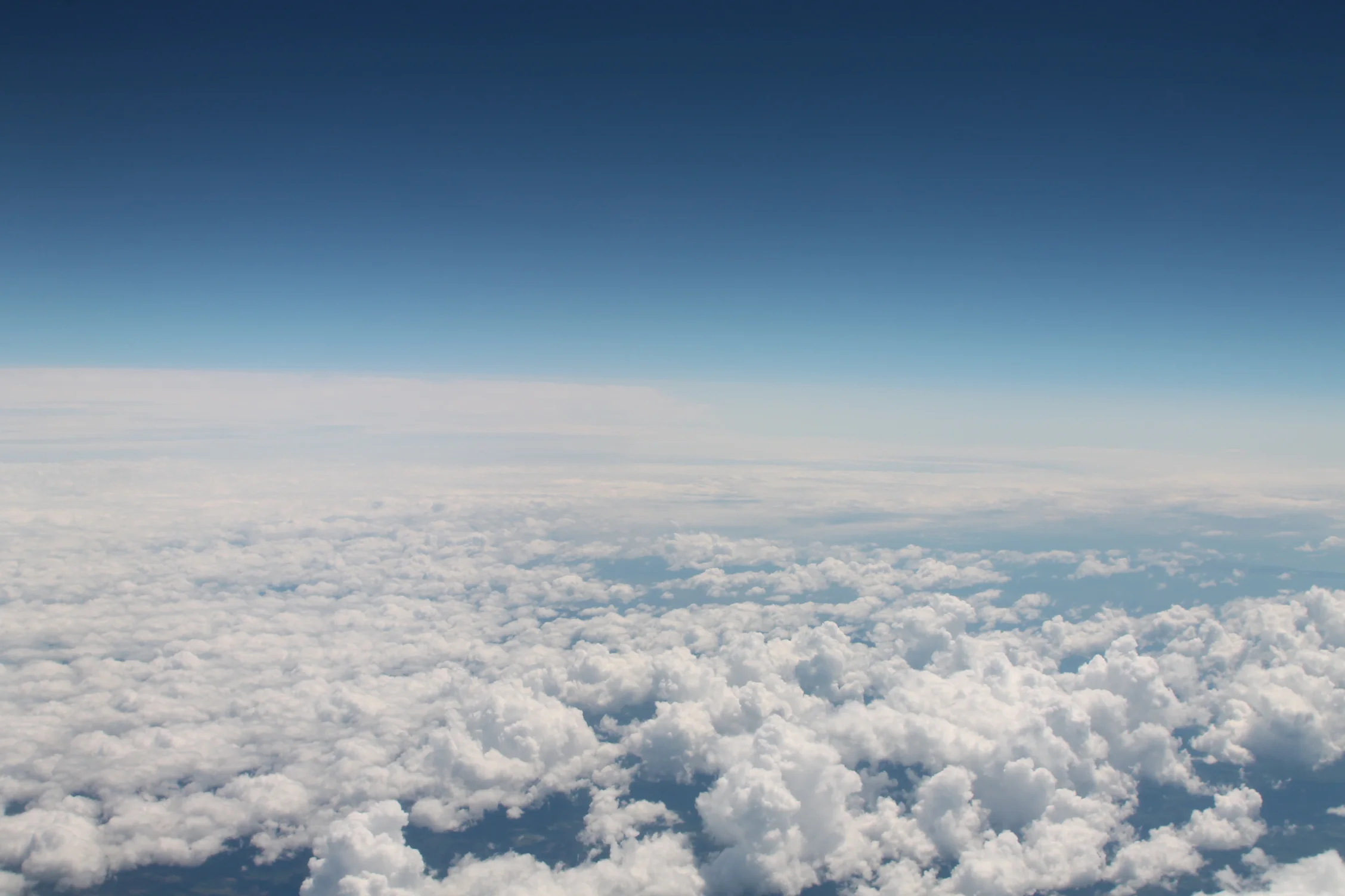Cumulus_clouds_as_seen_from_an_airplane.JPG
