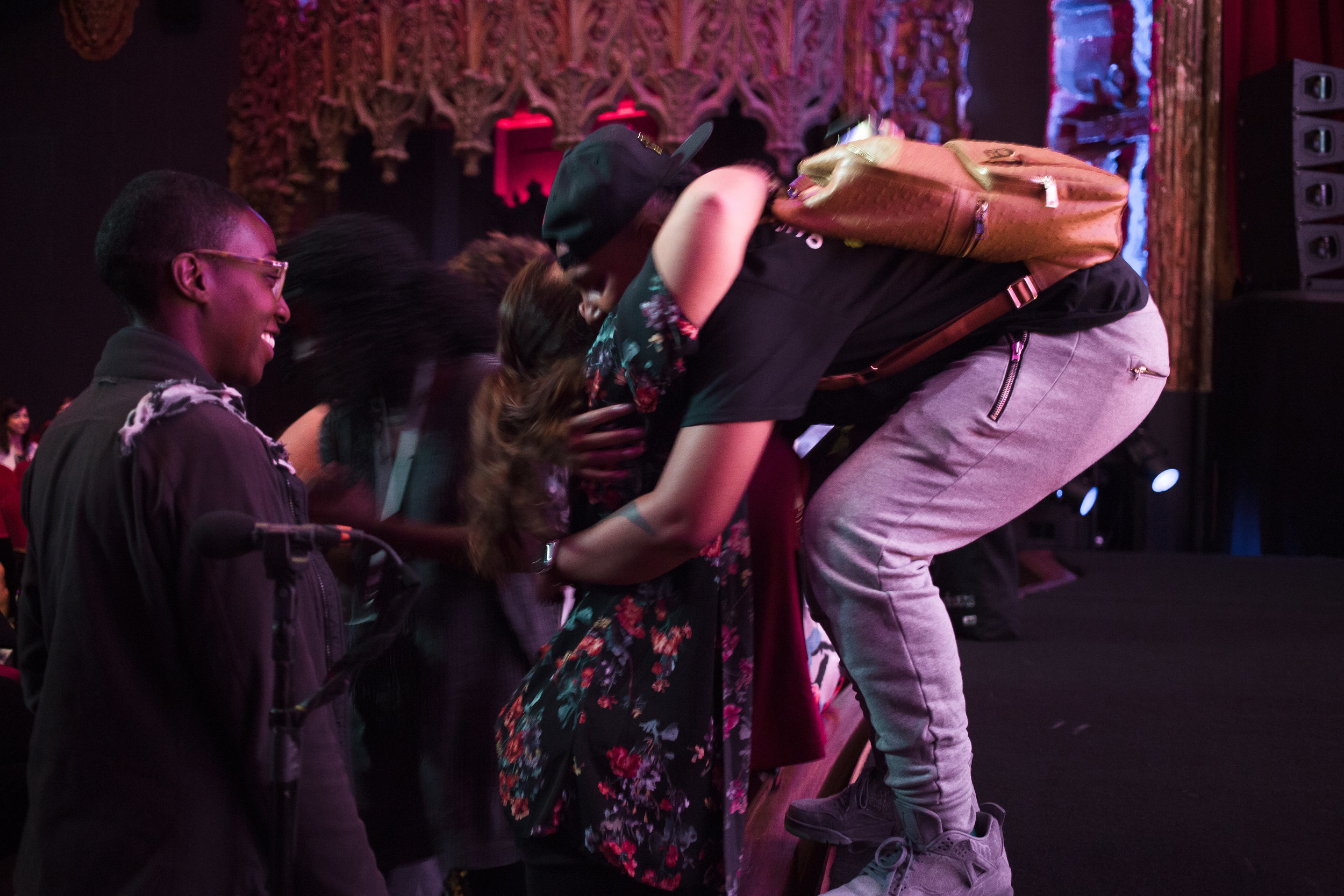 Lena Waithe hugging an audience member from the stage