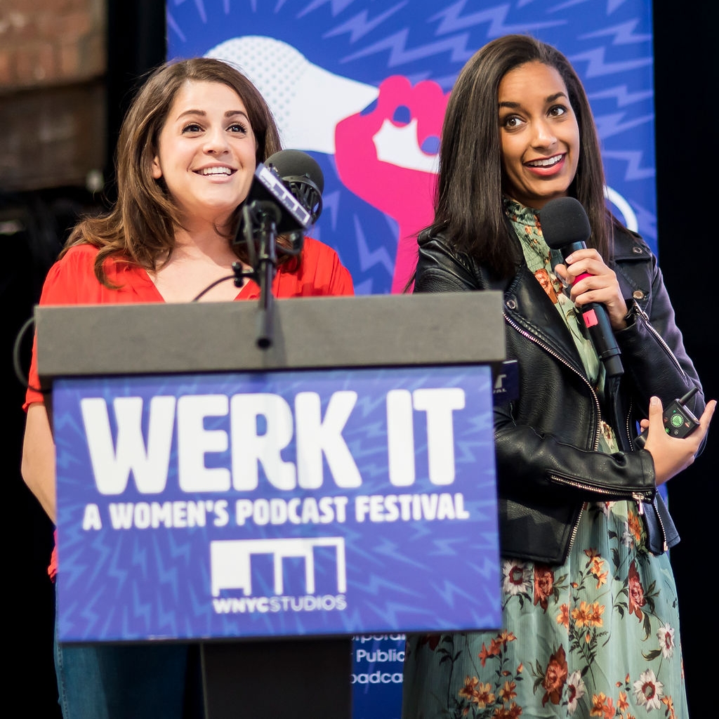 Becca Bressler and Bethel Habte presenting on stage behind a podium 