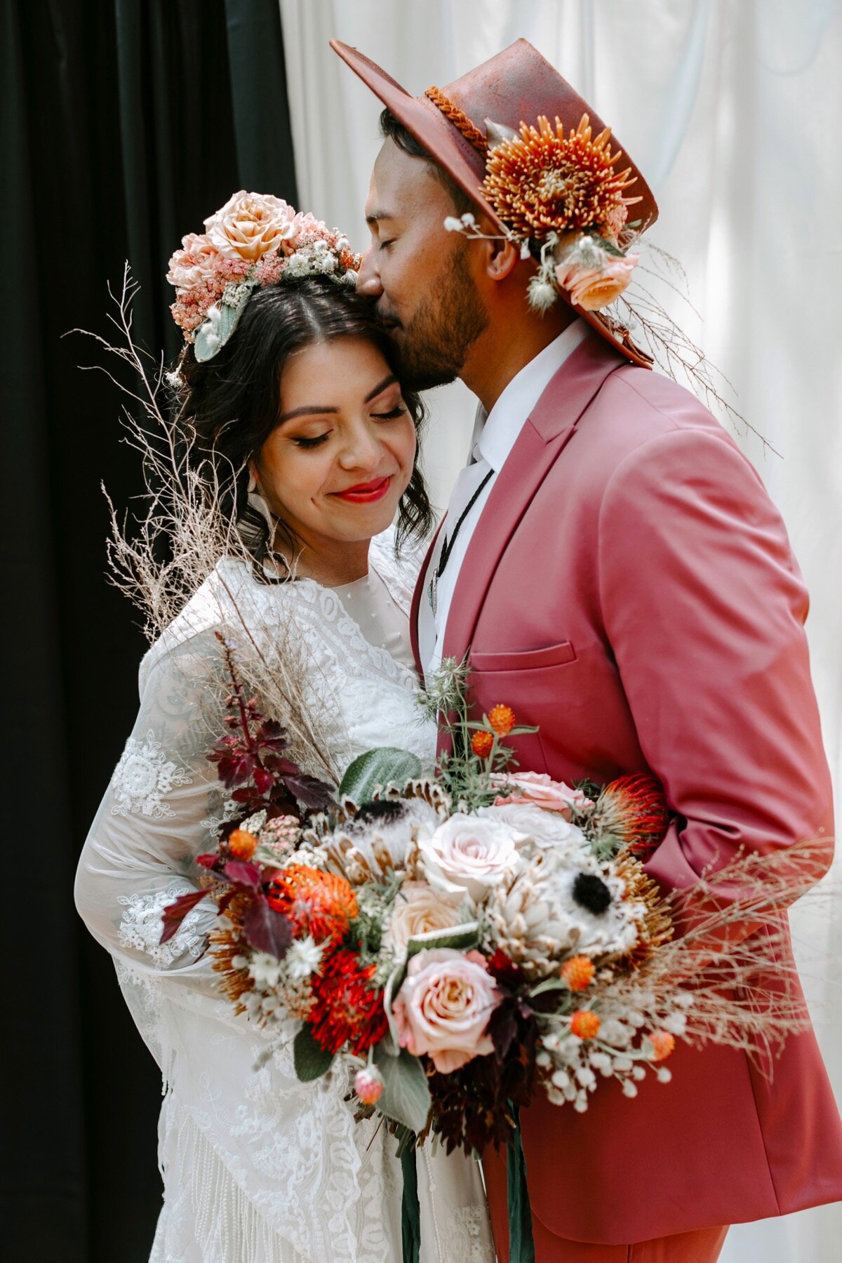 05_how-we-gather-097_tassels_colorful_suit_bradford_shoot_Chips_inspired_salsa_color_hat_Styled_hispanic_flowers_gatheringco_summer_cmp_groom.jpg