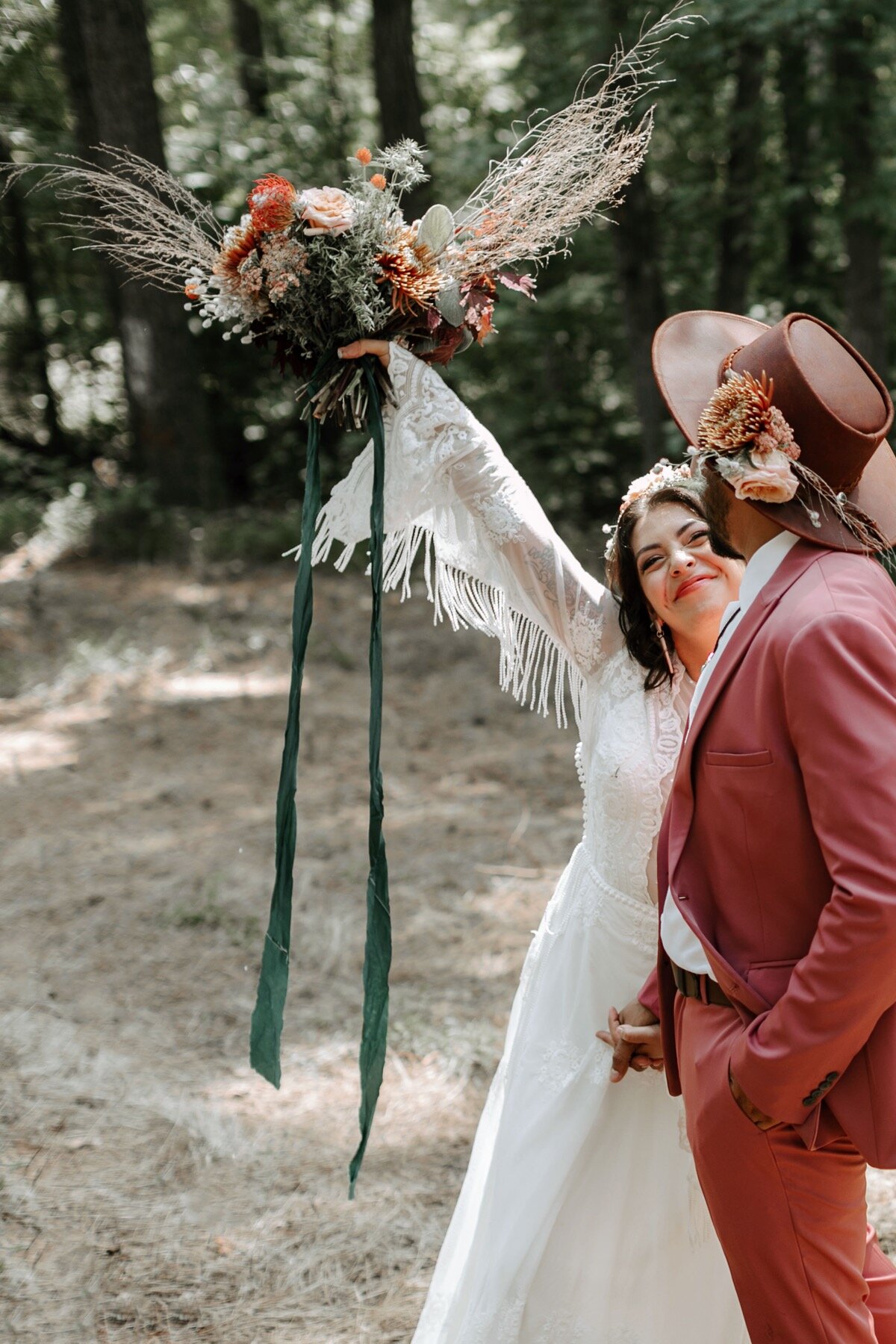 09_how-we-gather-107_tassels_colorful_suit_bradford_shoot_Chips_inspired_salsa_color_hat_Styled_hispanic_flowers_gatheringco_summer_cmp_groom.jpg