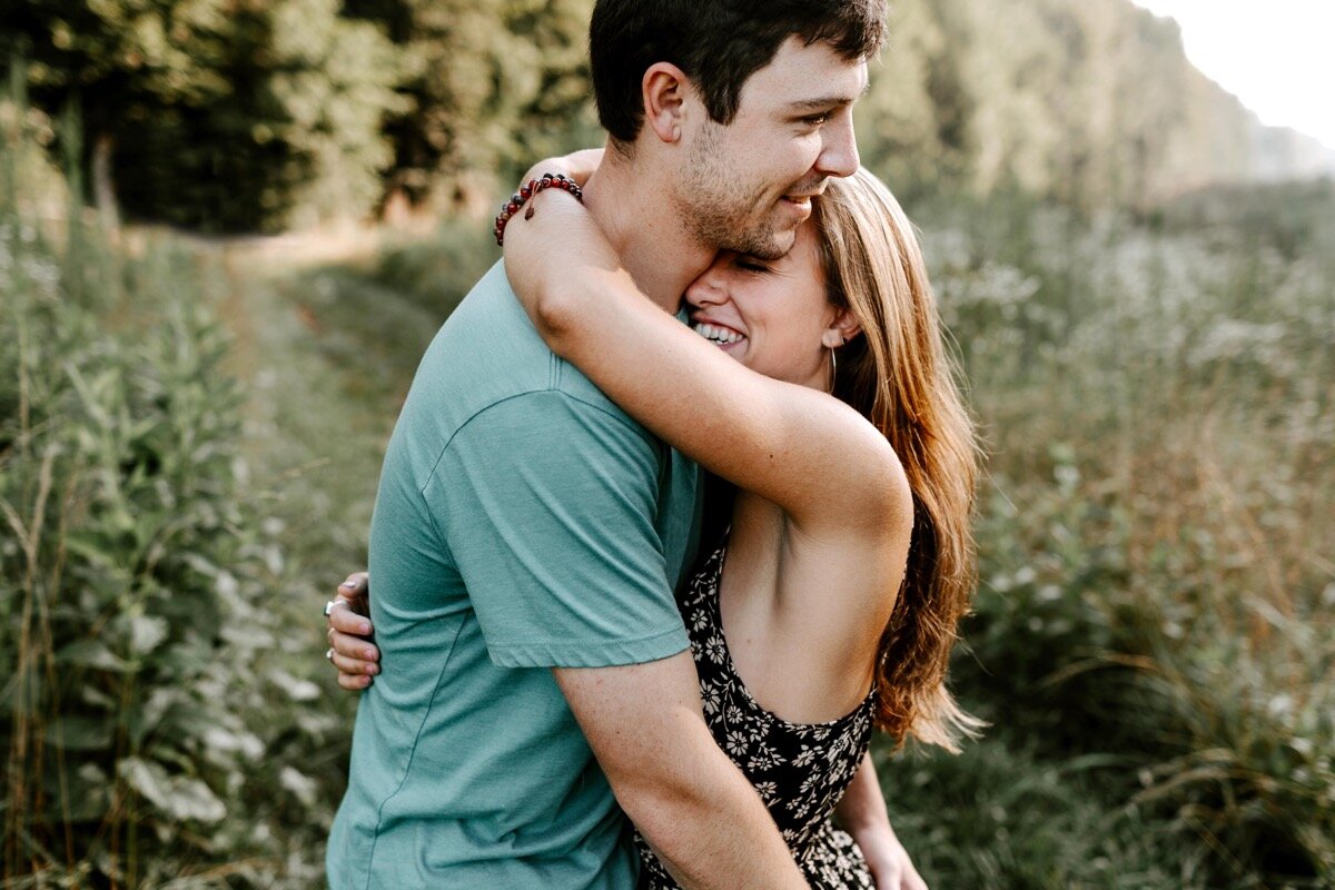 09_cmp-leah-mark-054_fields_couple_engagement_wildflowers_durham_dogs_Morning_Chapelhill.jpg