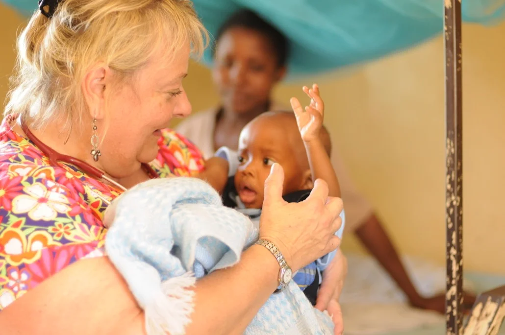 Debbie helping newborn.
