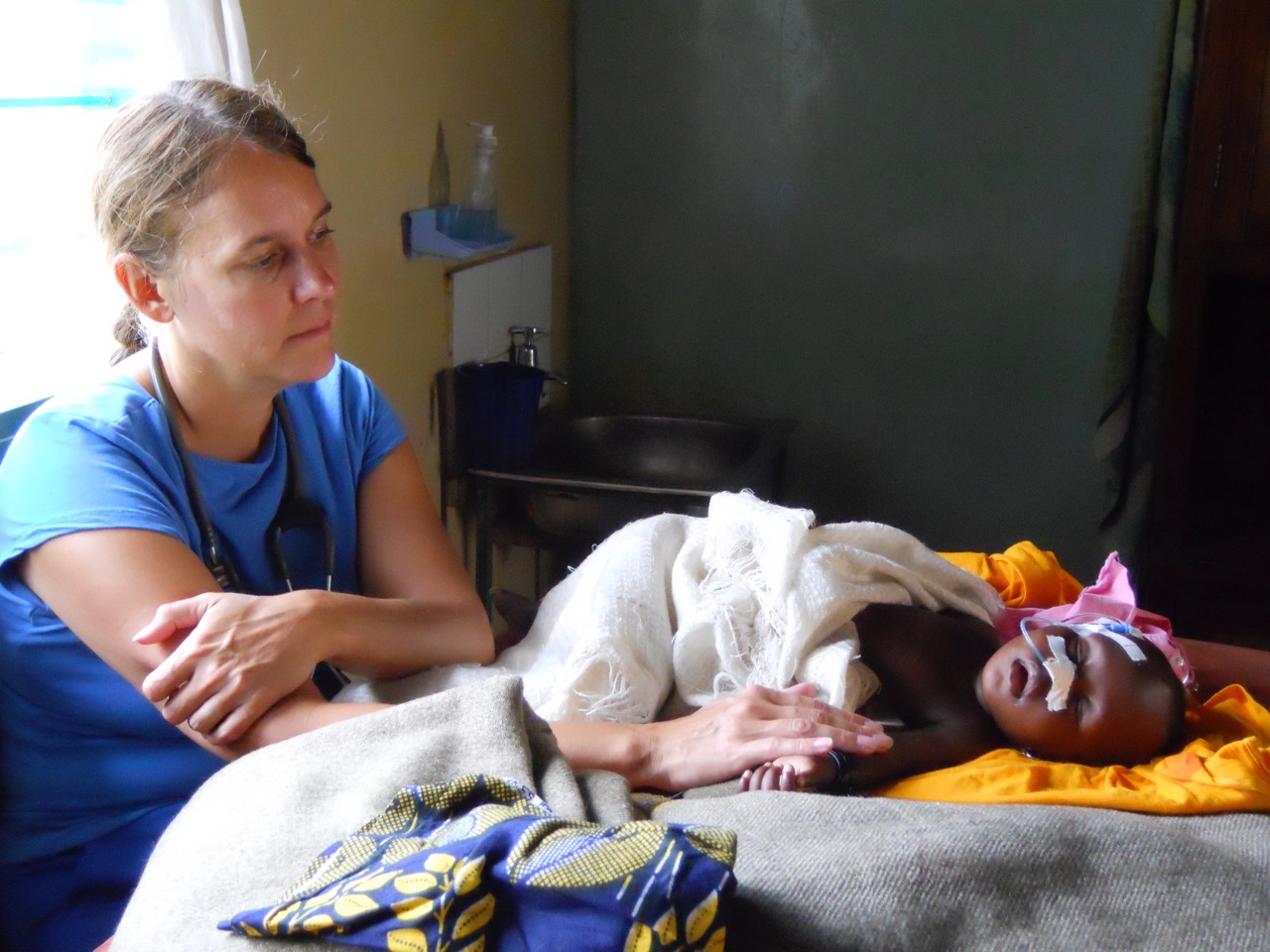 Rebecca monitoring baby with malaria.