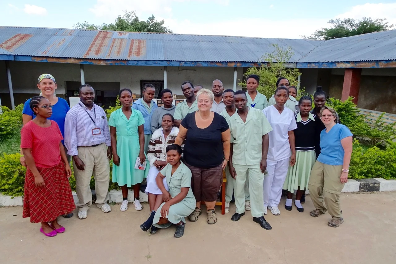 Rebecca, Debbie, and Dr. Gerlach with Mvimwa Holy Spirit Abby's Medical Staff.