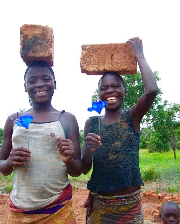 Zambia girls helping to build school.