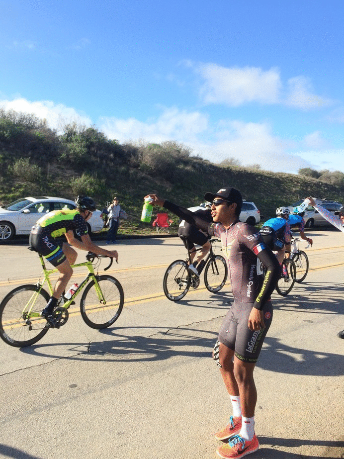 No, it's not the newest dance craze - it's Flight School racer Esdras Roldan working the feed zone at Saturday's Santa Barbara County Road Race.