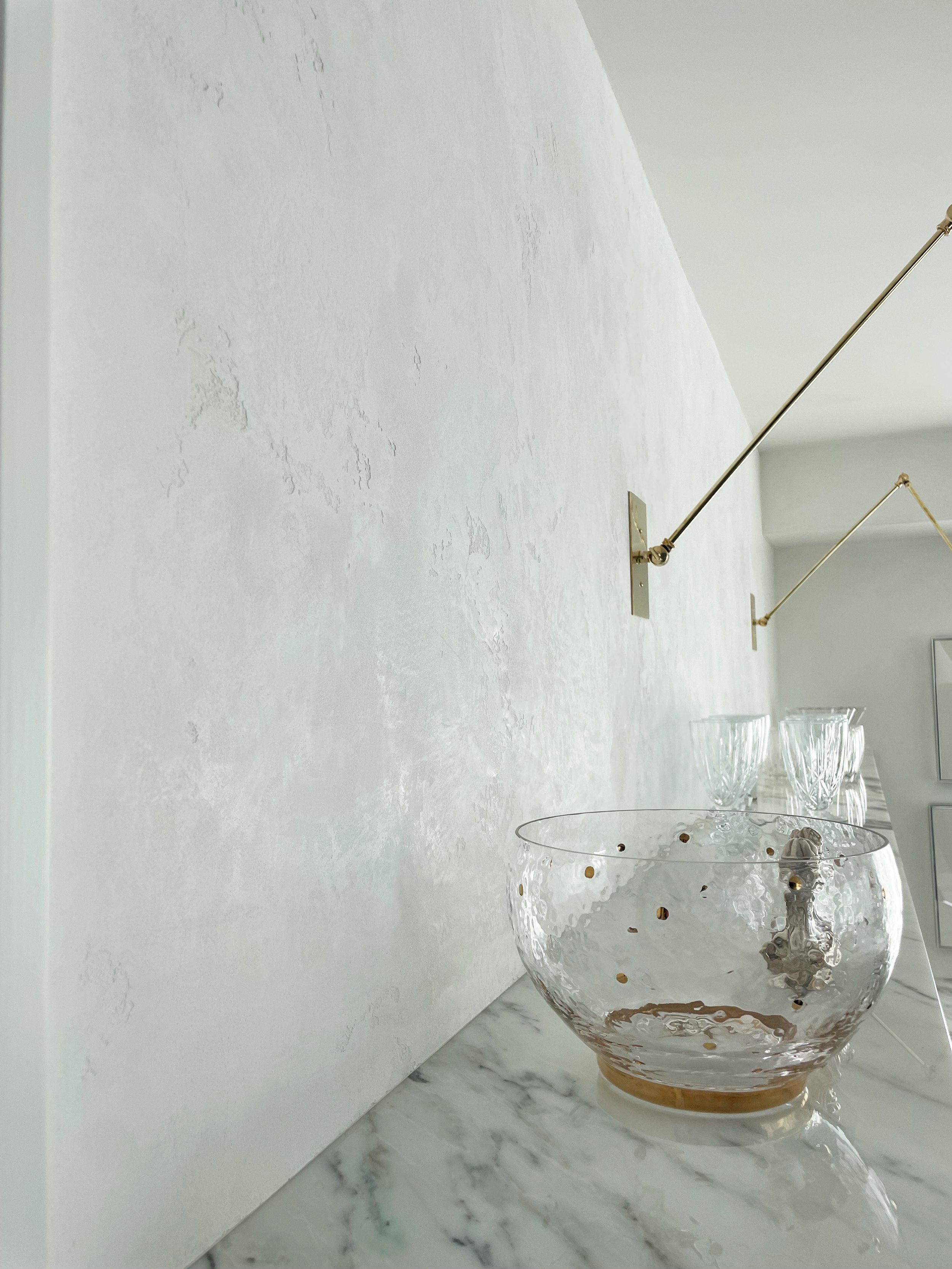 10 Textured, burnished and waxed pristine white marmorino plaster for a light filled 21st story Wilshire Blvd penthouse.jpg