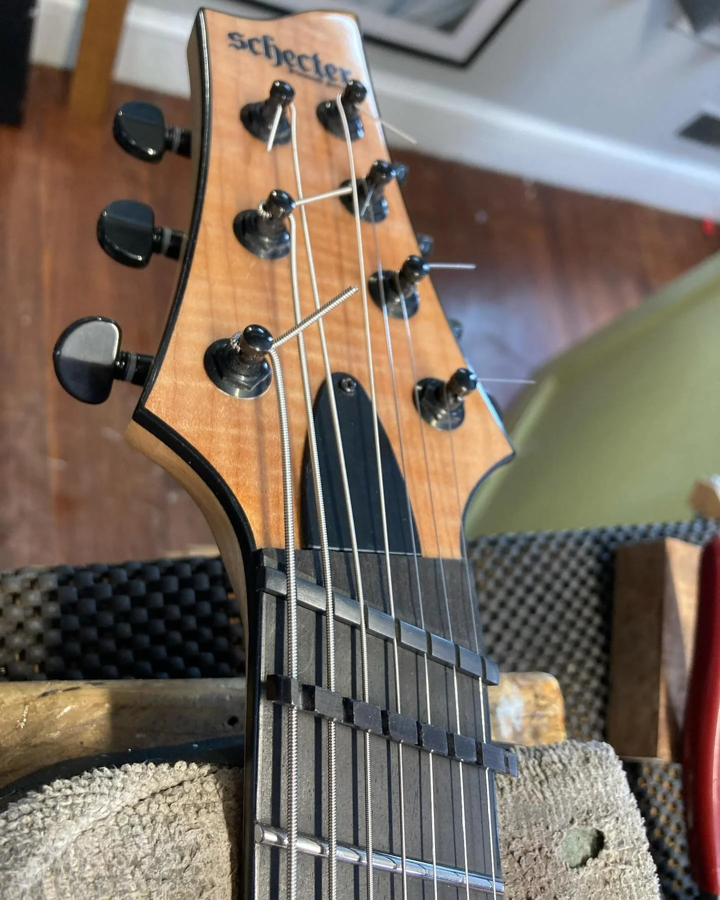 Finishing up a new @graphtechguitarlabs Tusq blank for this @schecterguitarsofficial #7string #guitar and then gonna clip off those needles. Ouch. 😬🫨😬