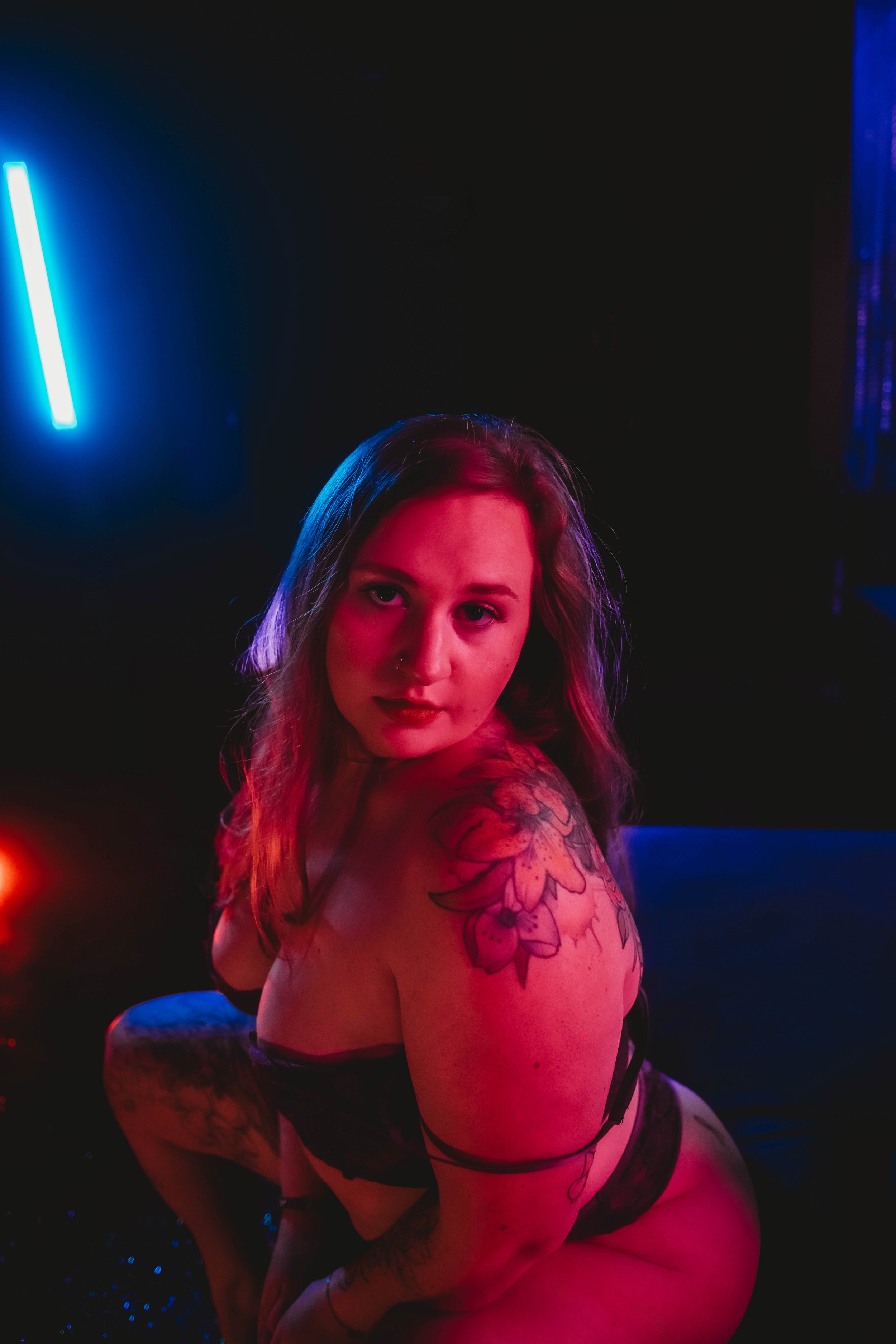 Boudoir photography session with dramatic contrast lighting in Terre Haute, Indiana