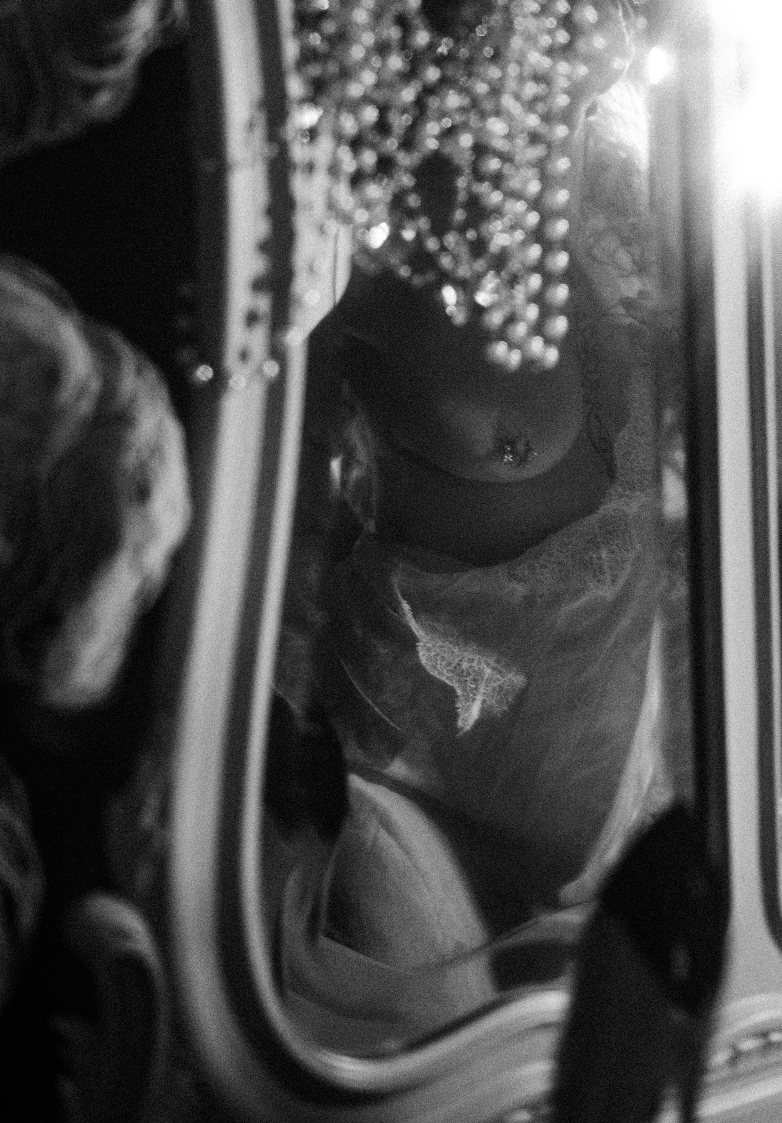 Editorial boudoir portrait in Terre Haute with mirror reflection and soft monochrome lighting