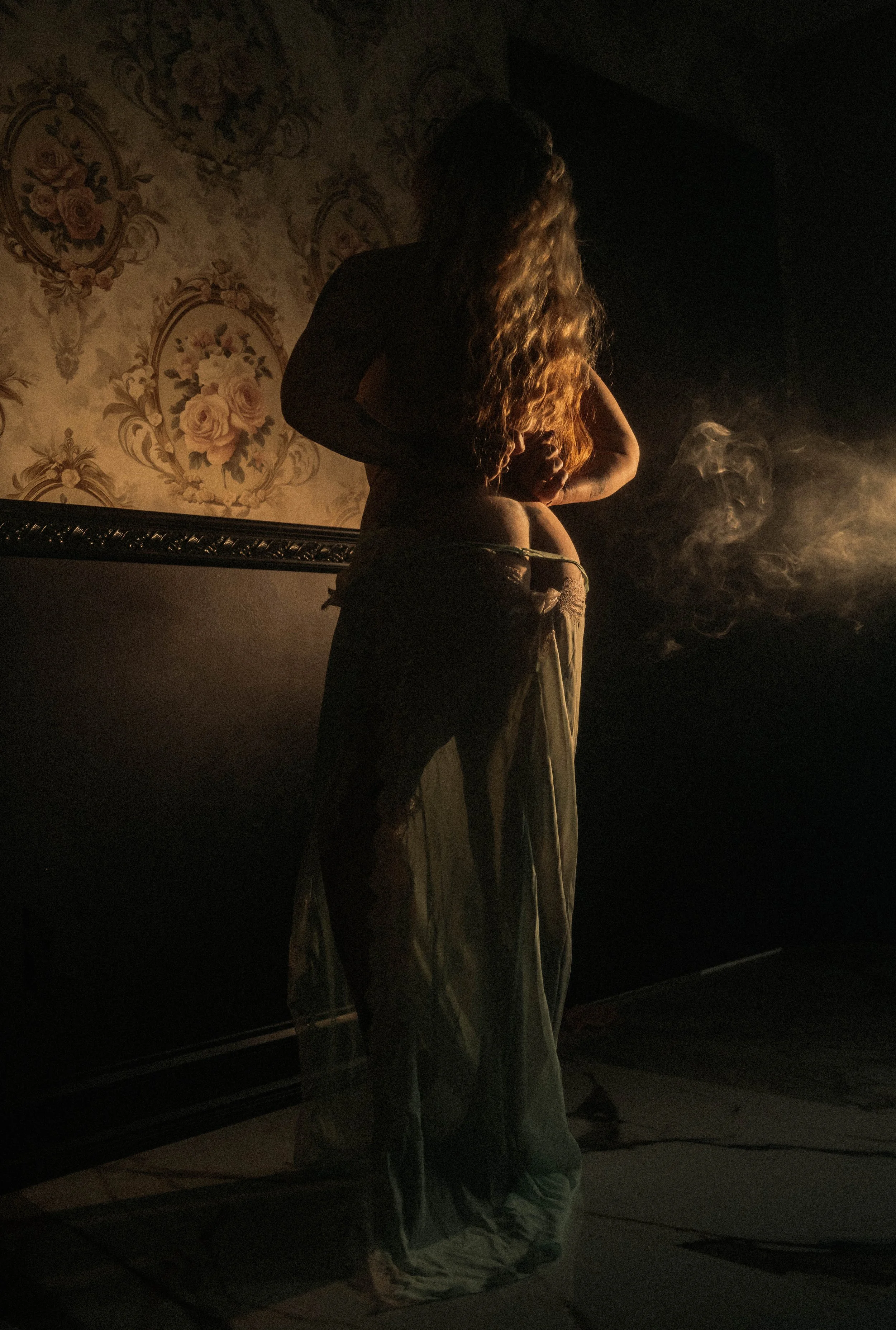 Silhouette boudoir photography in Terre Haute with warm light and flowing fabric