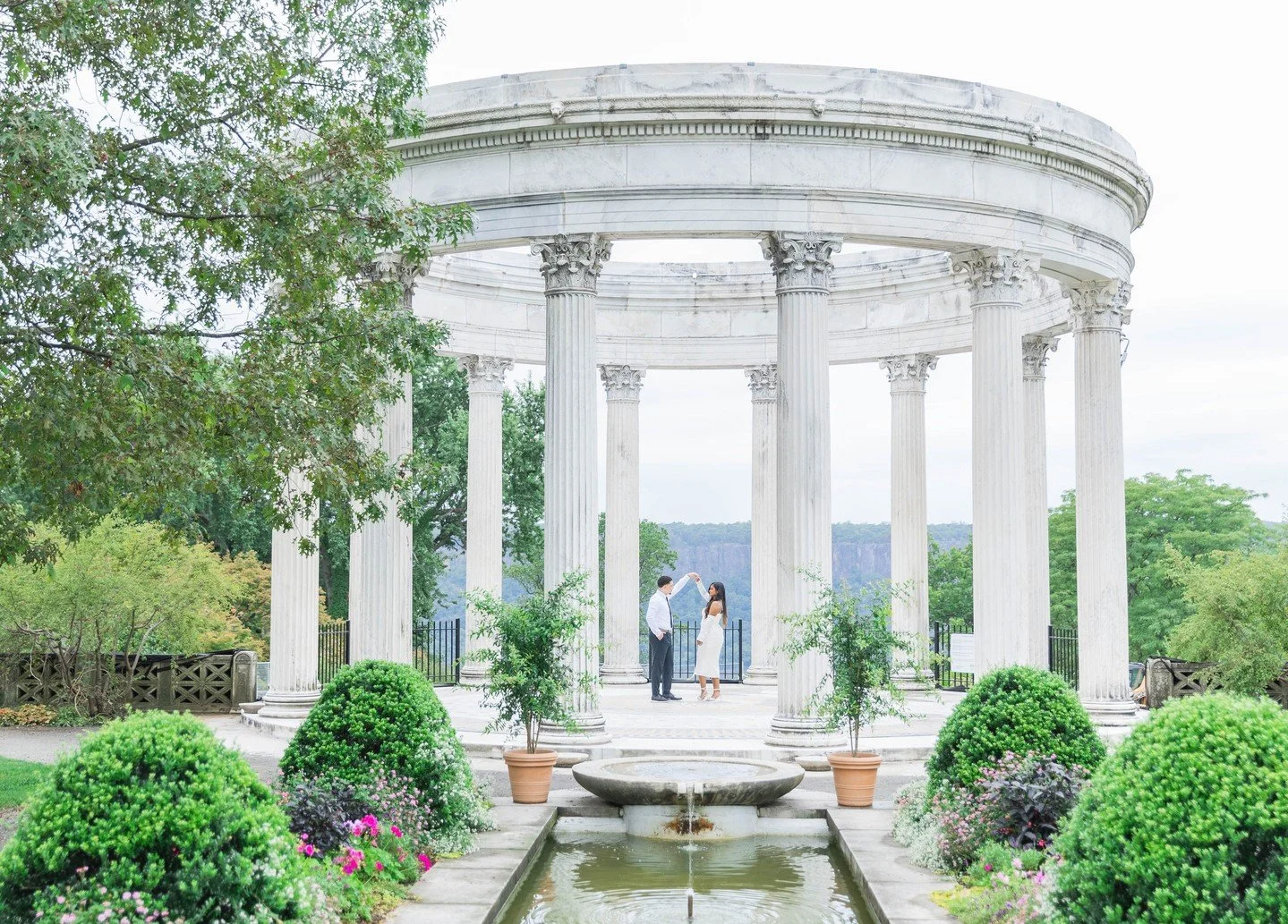 Finding the perfect engagement session location is just as important as capturing the right moments. One of my favorites is Untermeyer Garden. Every corner provides a beautiful backdrop for timeless, romantic photos&mdash;just look at Grizel and Rand