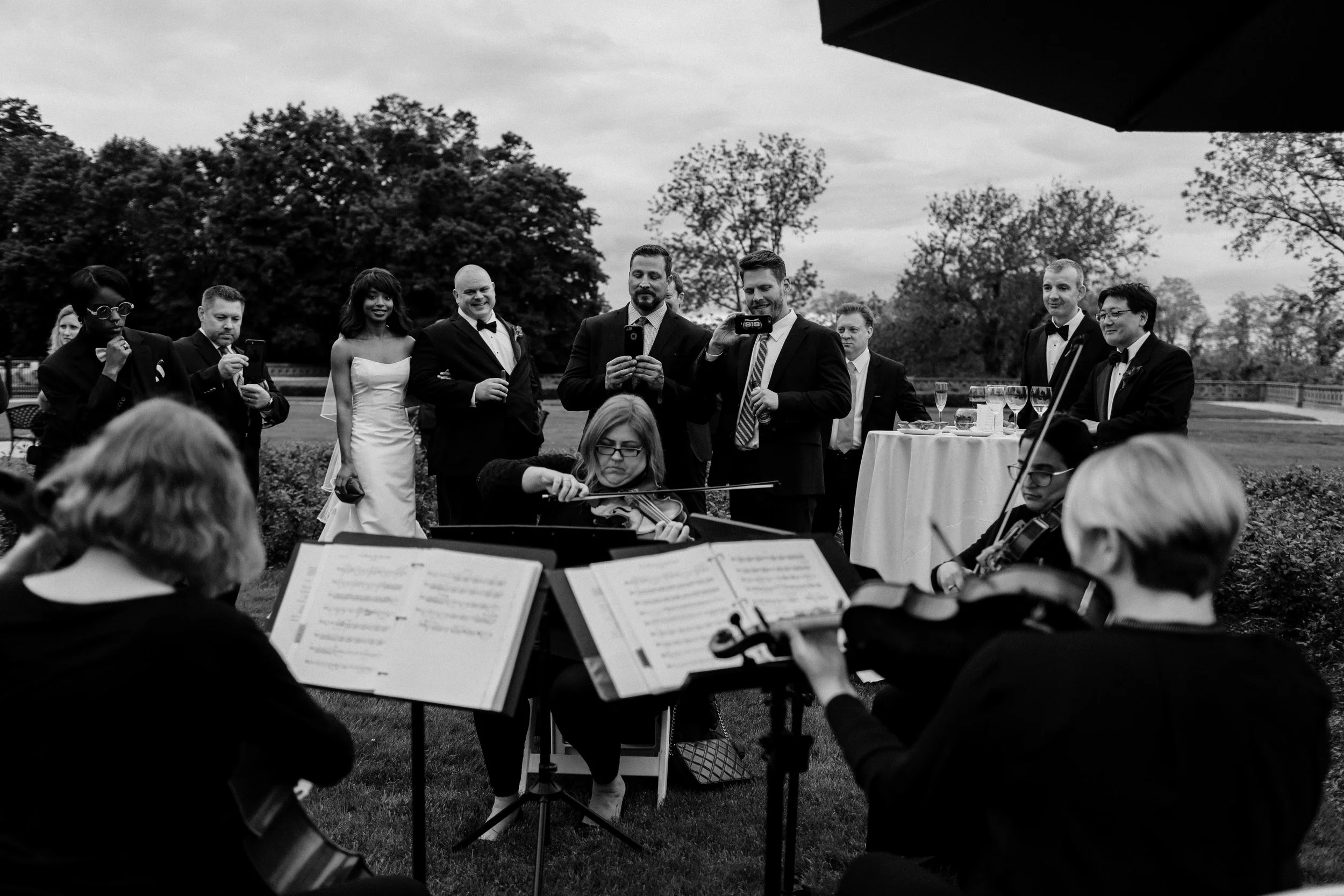 Luminous Sounds String Quartet performing for an outdoor cocktail hour at The Hempstead House, Sands Point, NY