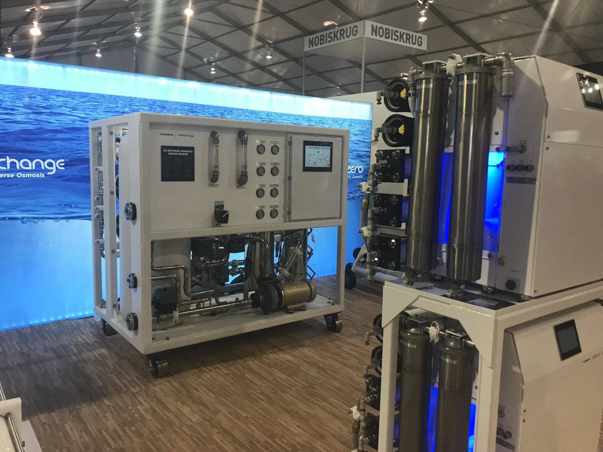 A large watermaker from Dometic as presented at the 2017 Ft. Lauderdale Boat Show. Smaller systems in the foreground.
