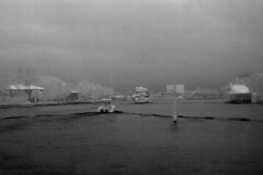 Flir thermal camera image of a busy harbor in the middle of the night.