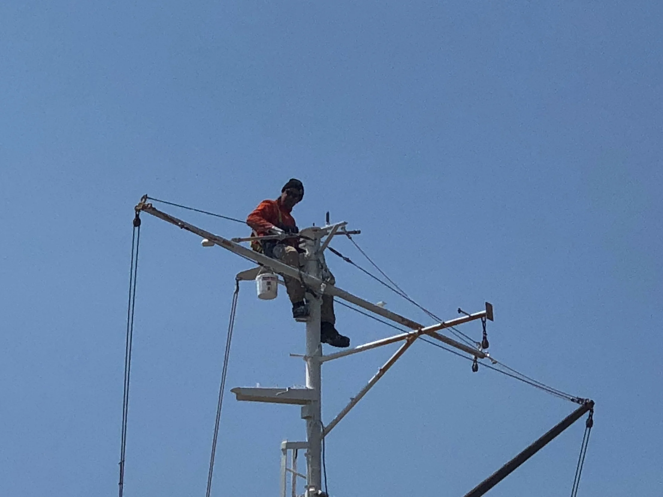 Leo painting the aft mast