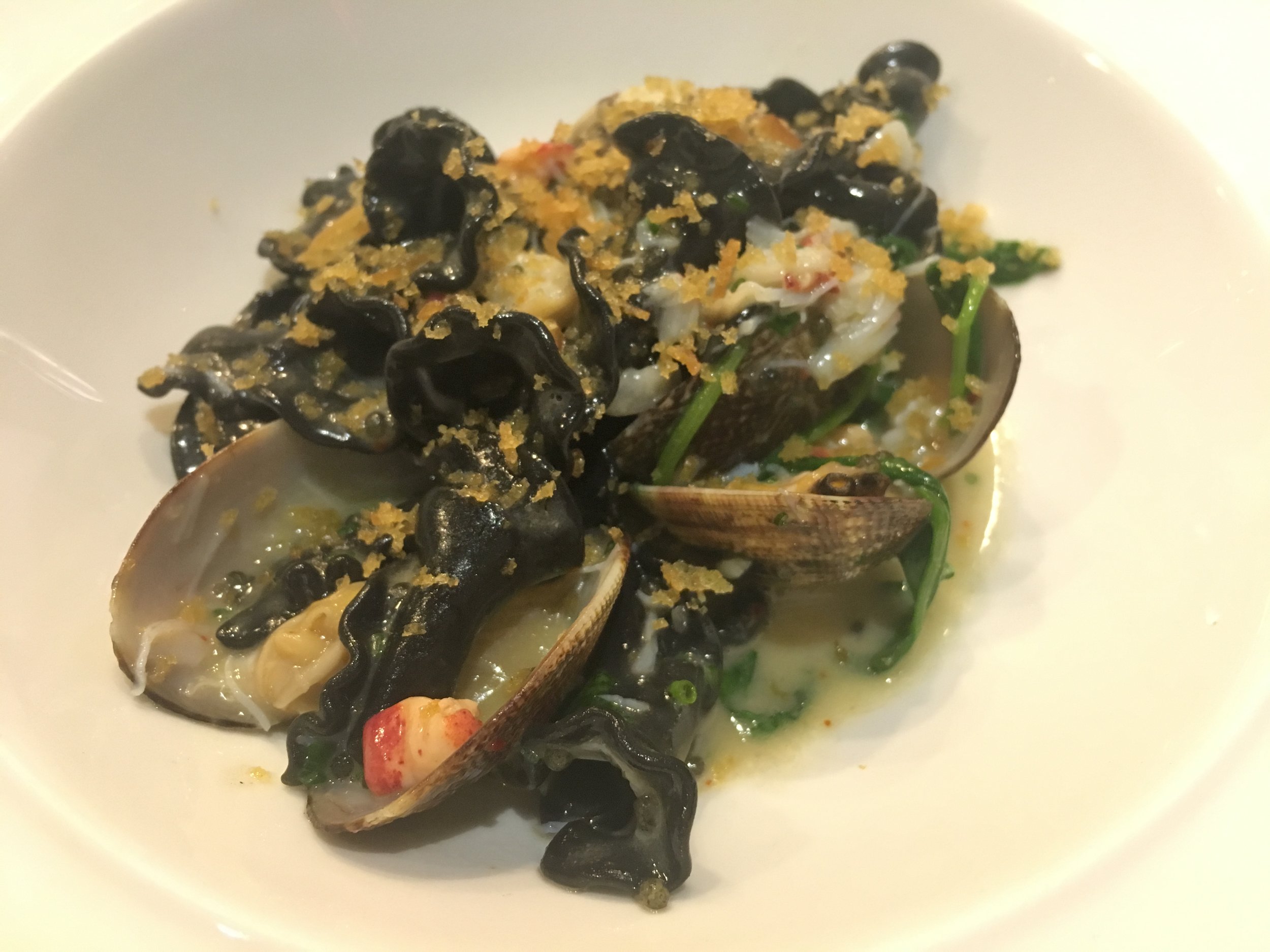 Squid ink carmenelli replete with peekytoe crab, lobster, caviar, and razor and manila clams