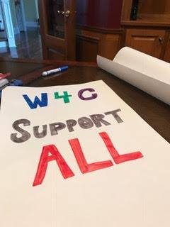 Co-founder Jennifer Williams sign