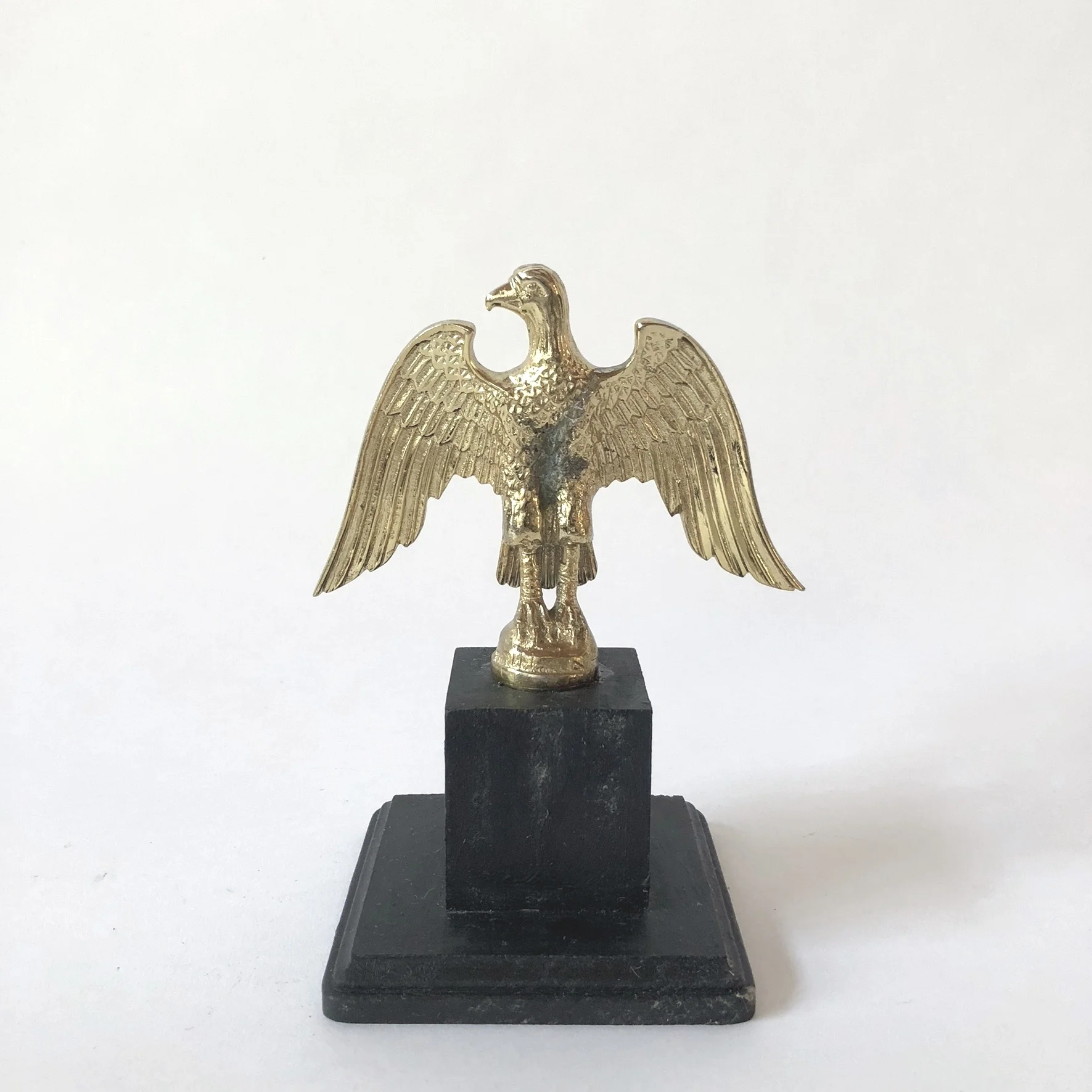 Brass figural eagle flag pole finial mounted on wood base. 4in x 4in x 7in H. $68