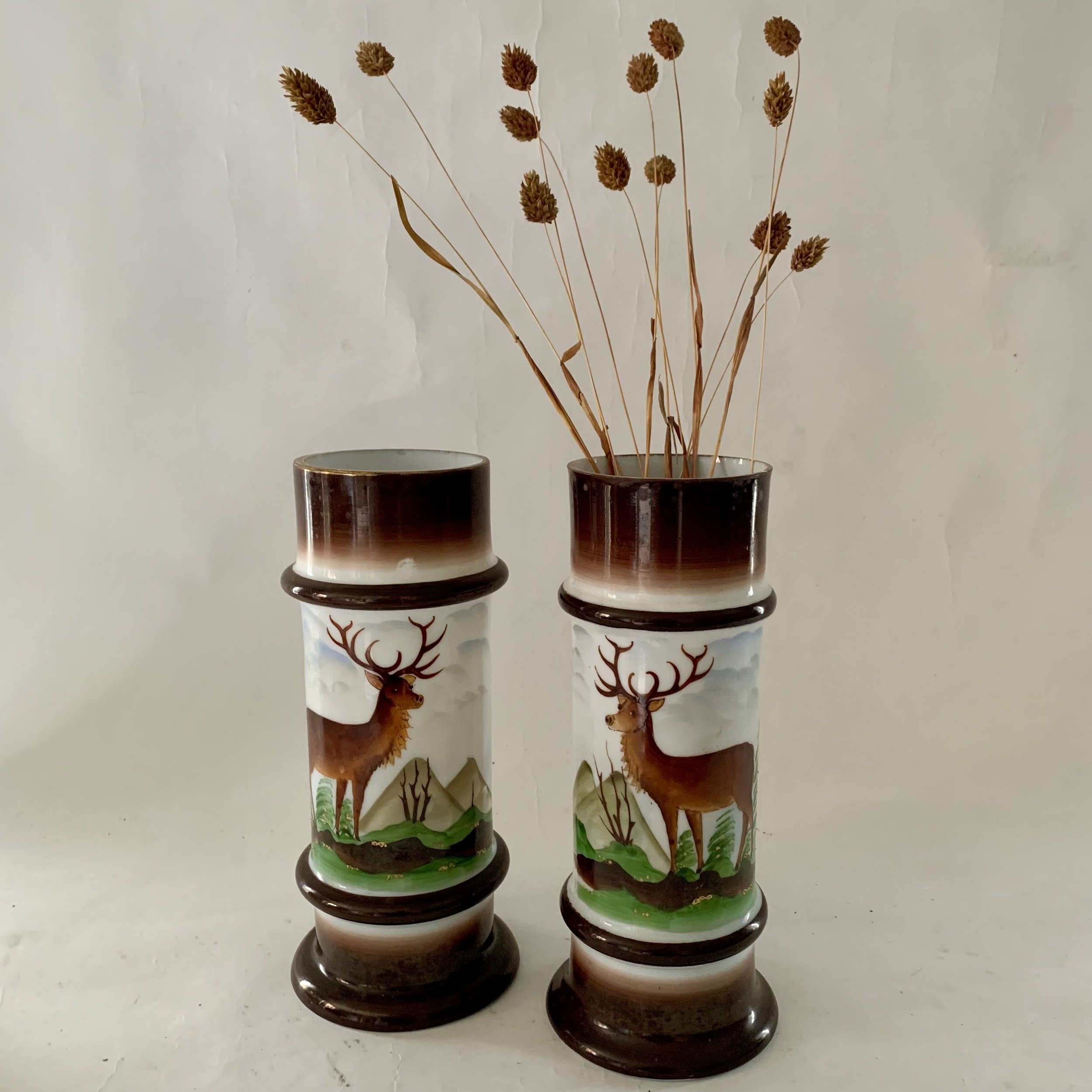 A sensational folk art find! Pair of late 19th century hand painted glass vases. 11”H. $115.00pr.