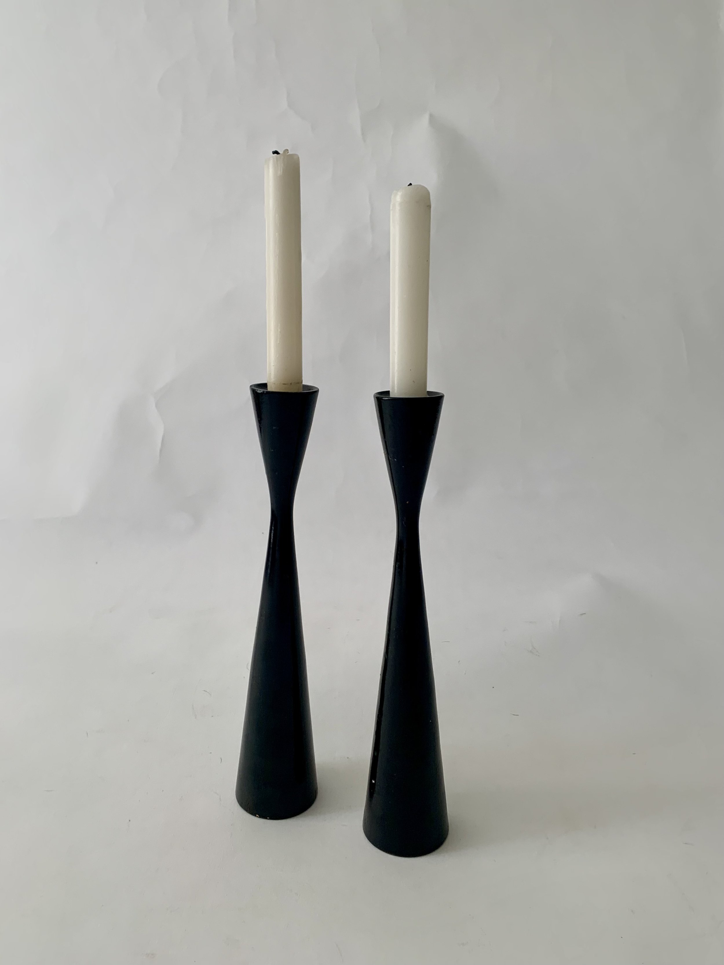A cool pair of mid-century black wooden candlesticks. 11”H. $68.00/pair
