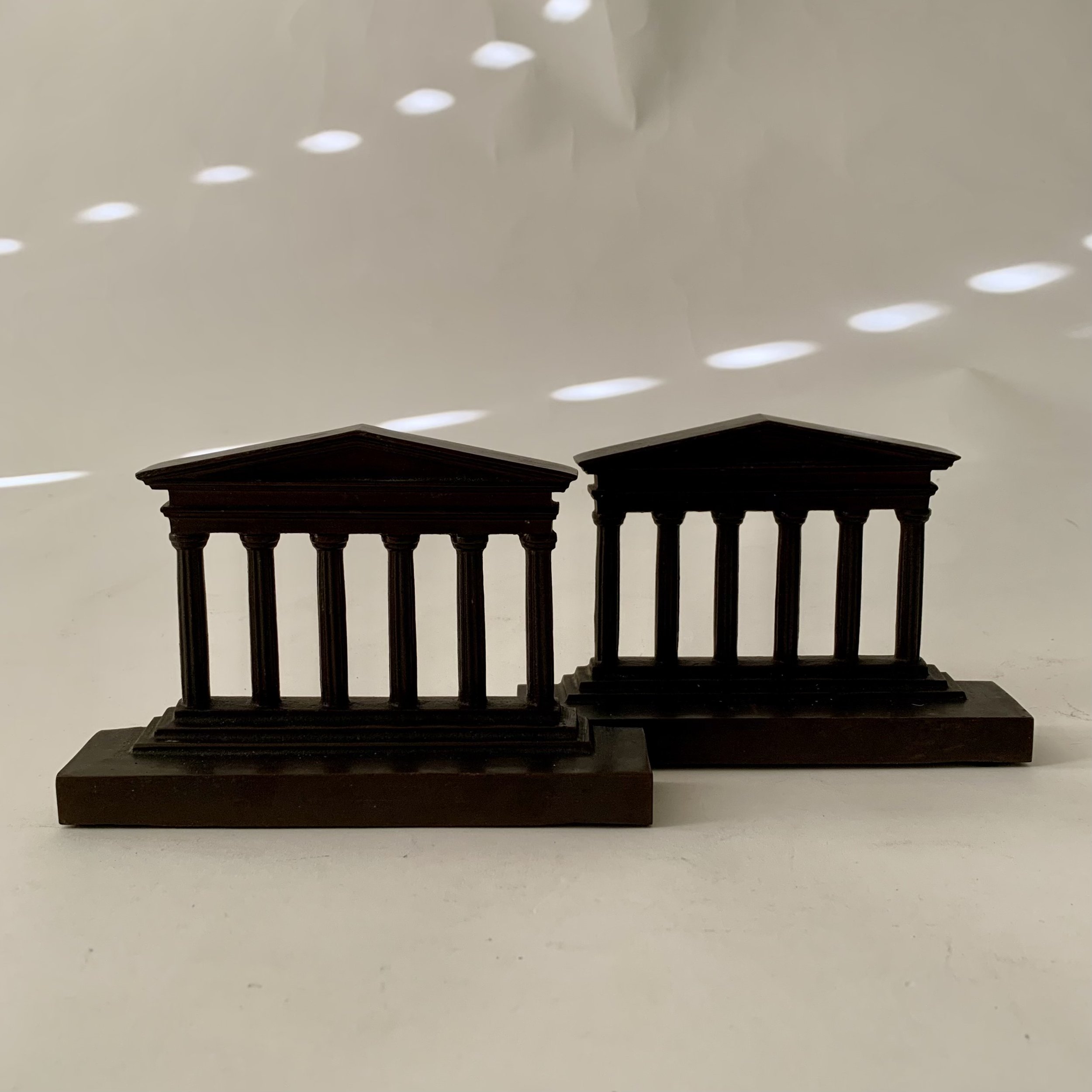 A pair of architectural form cast iron bookends. $78.00/pair