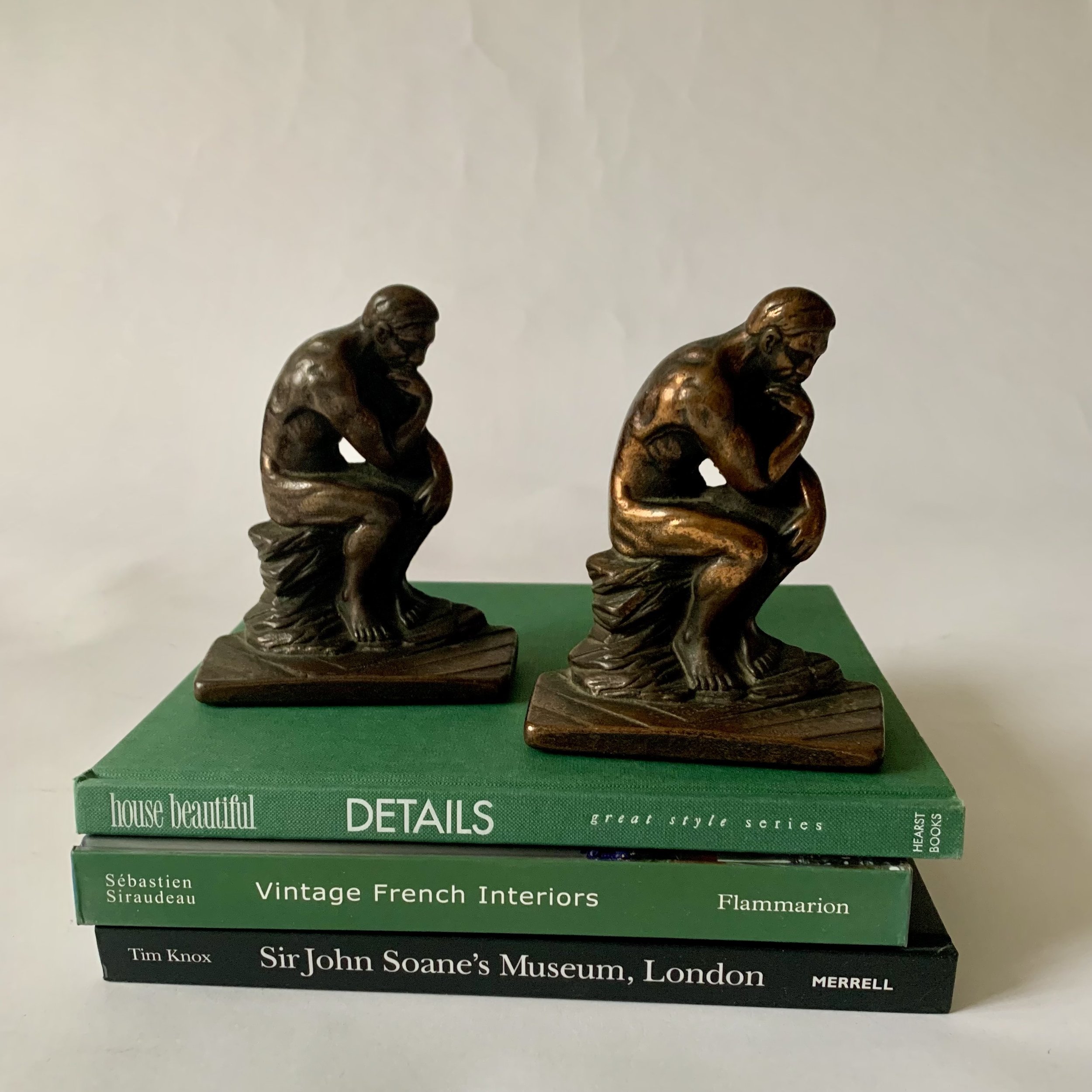 Pair of cast iron bookends based on Rodin’s The Thinker. Great old patina! $68.00/pair