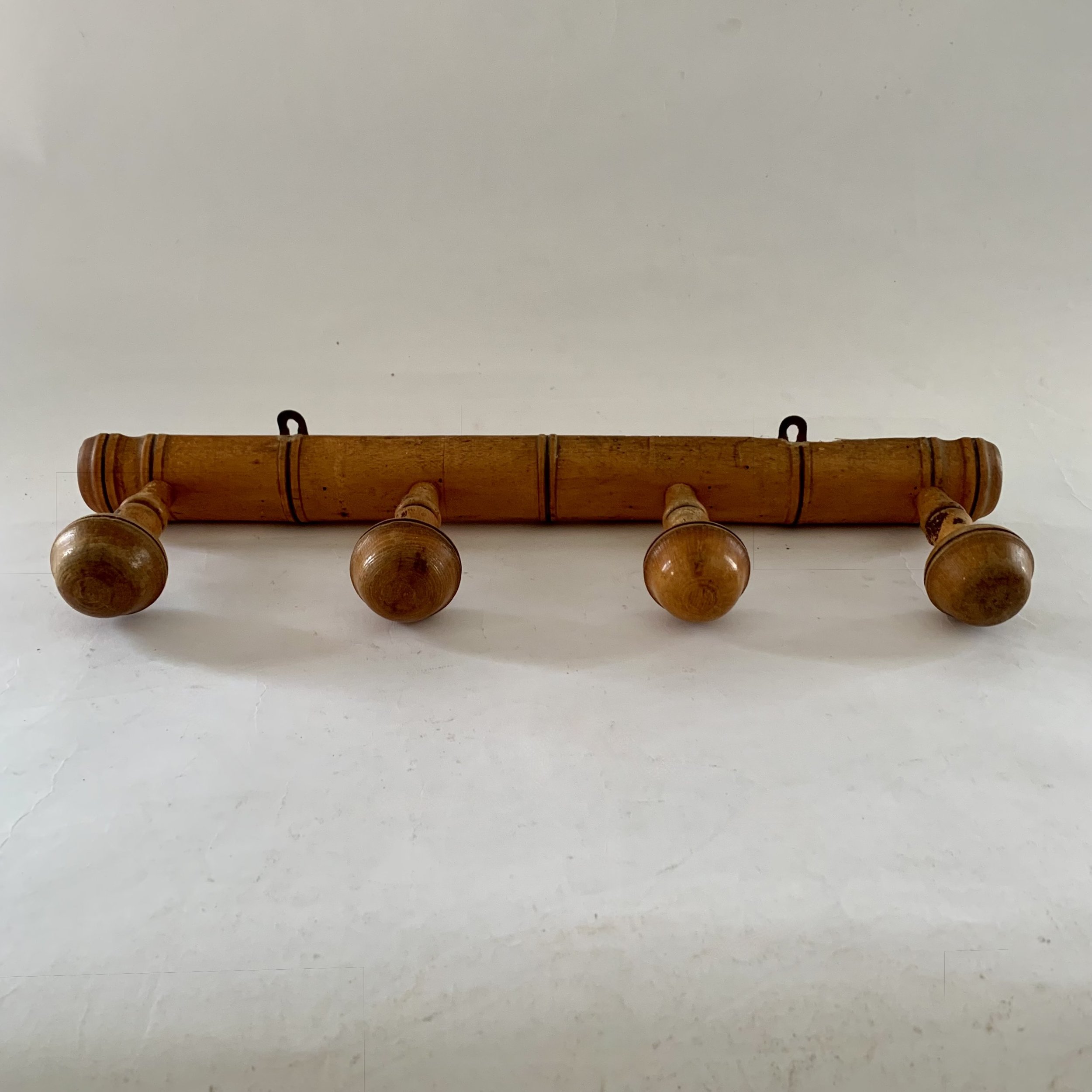 A classic French faux bamboo coat rack. 19”long. $115.00