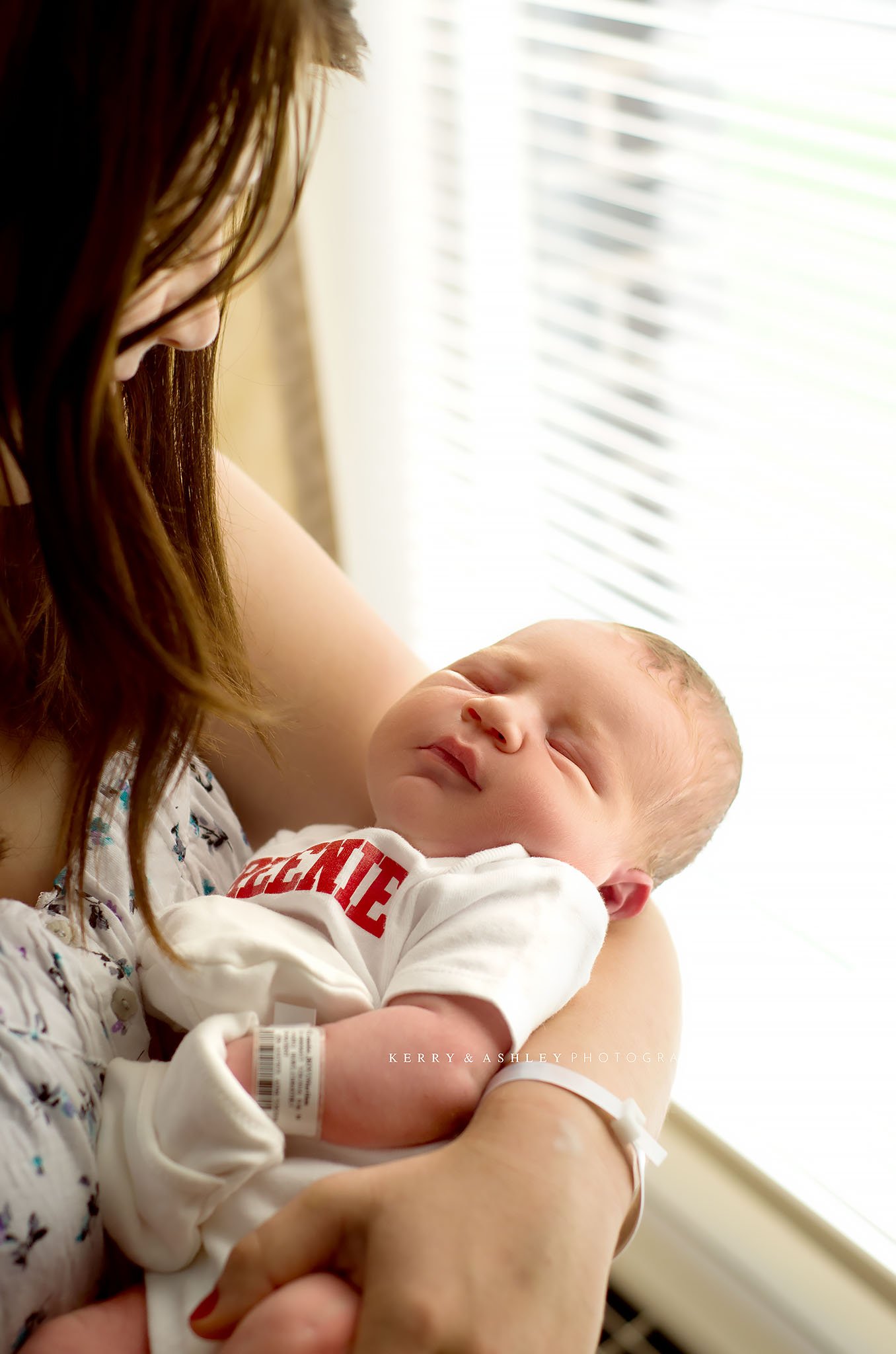 mom-holding-newborn-by-window.jpg