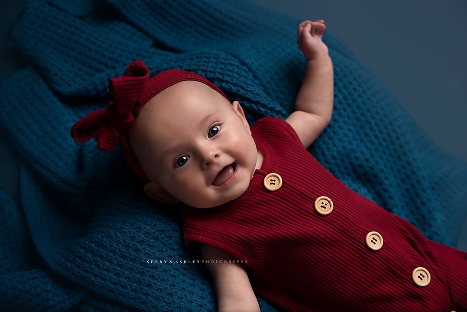 baby-wearing-red-knit-onesie.jpg