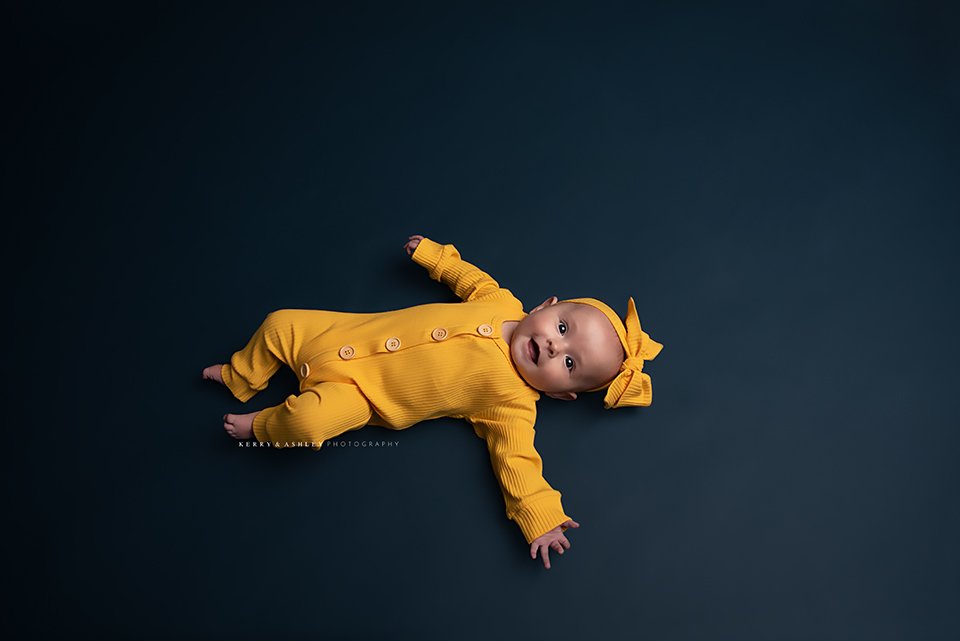 baby-wearing-yellow-outfit.jpg