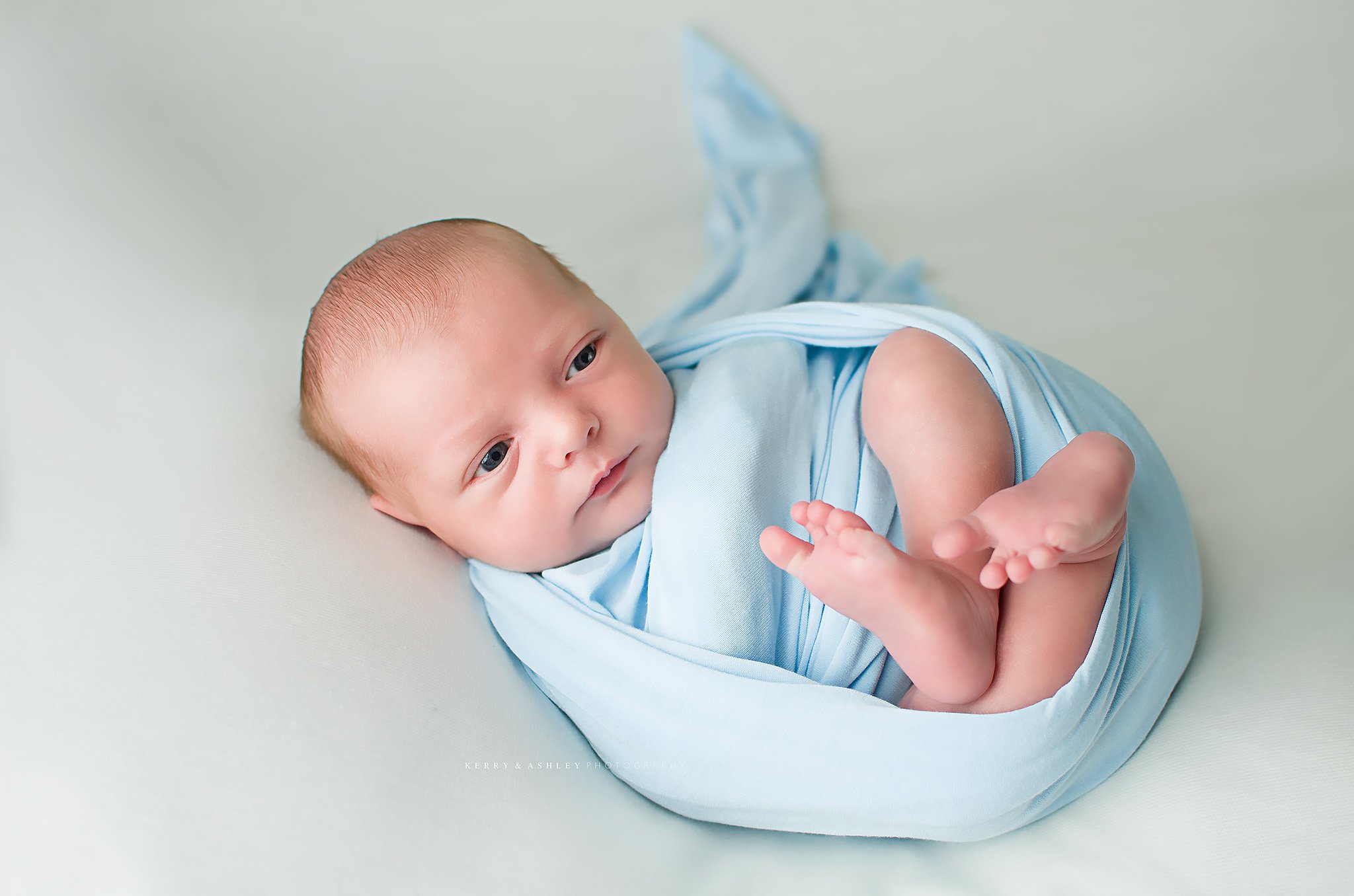 newborn-baby-in-blue-wrap.jpg