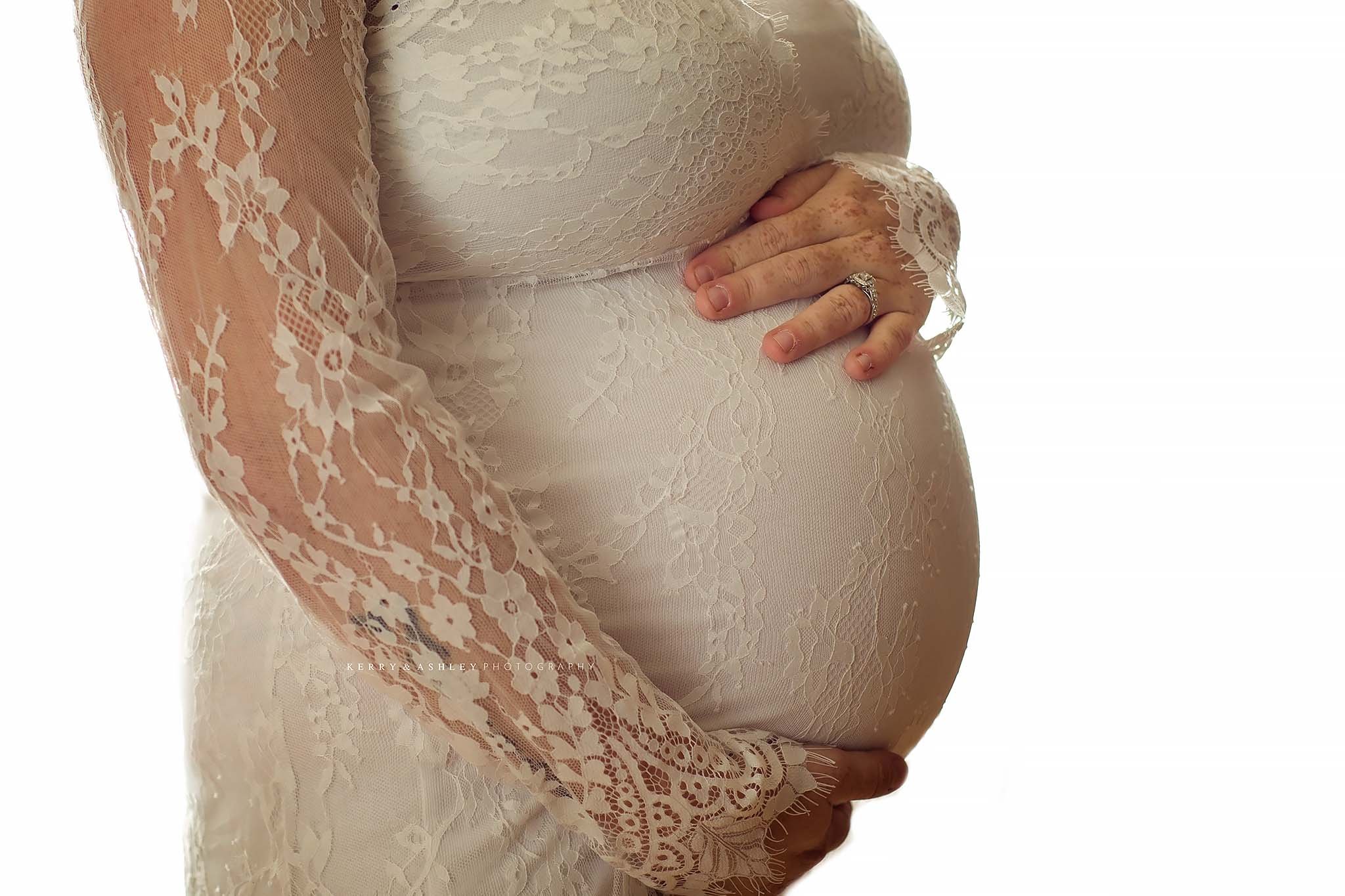pregnant-mom-wearing-white-lace-dress.jpg