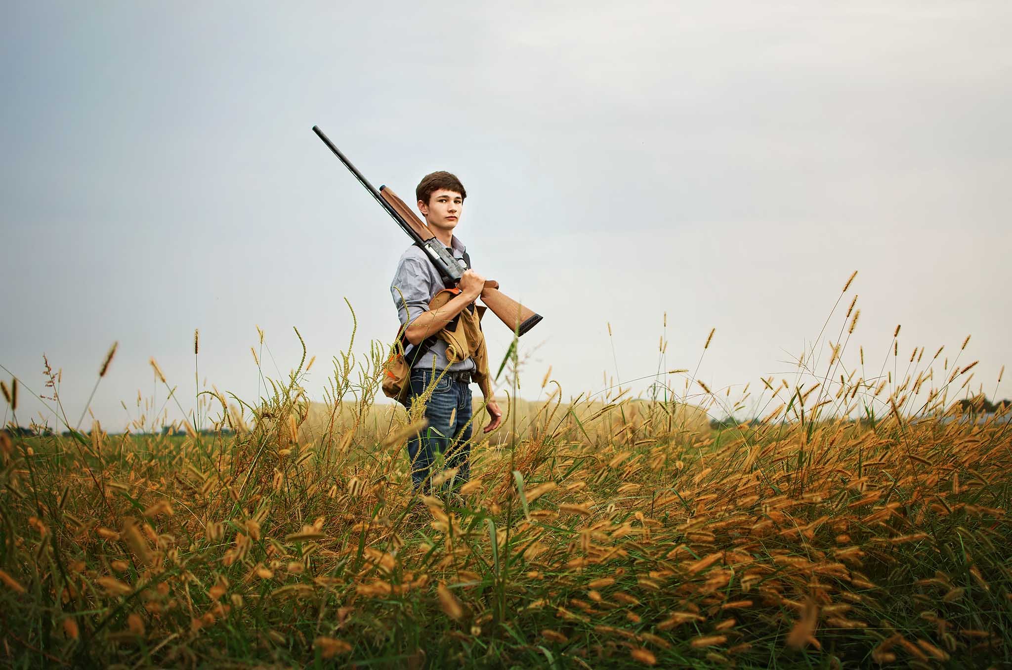 senior-boy-in-hay-field.jpg