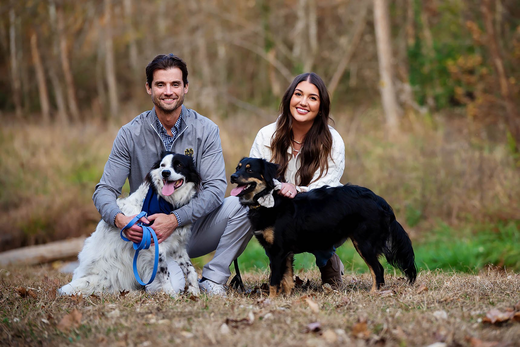 husband-and-wife-with-2-dogs.jpg