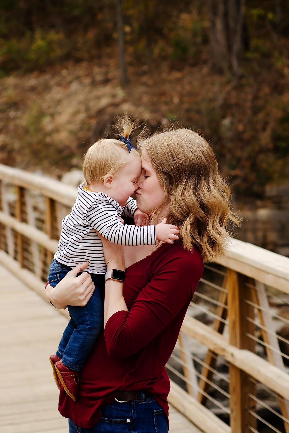 mom-kissing-baby-on-bridge.jpg