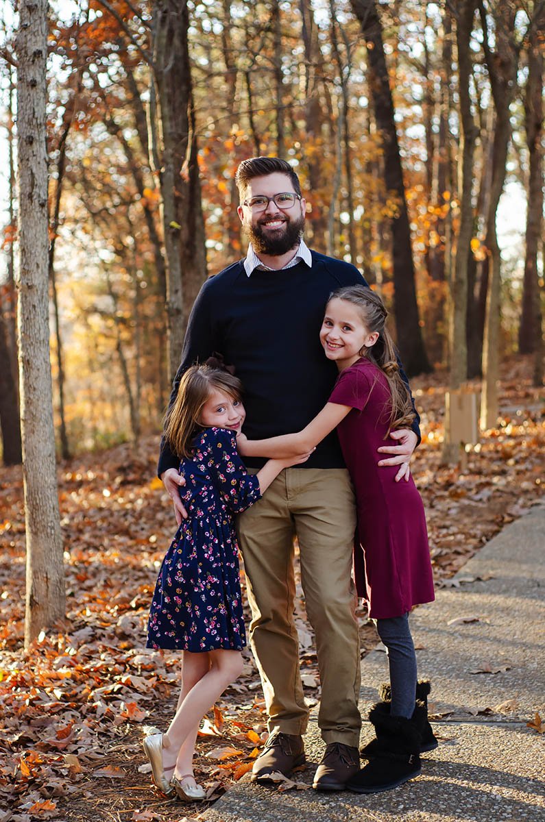 dad-standing-with-two-daughters.jpg