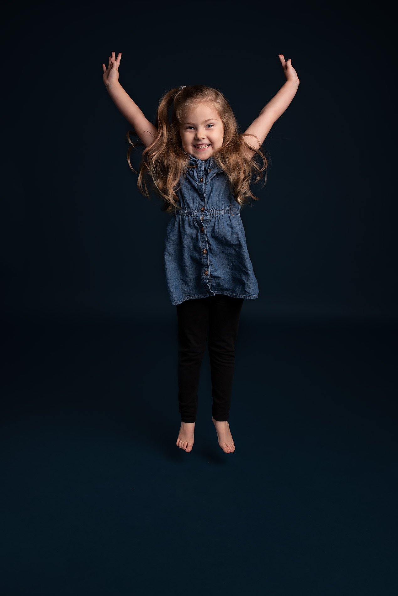 preschooler-jumping-with-arms-above-head.jpg