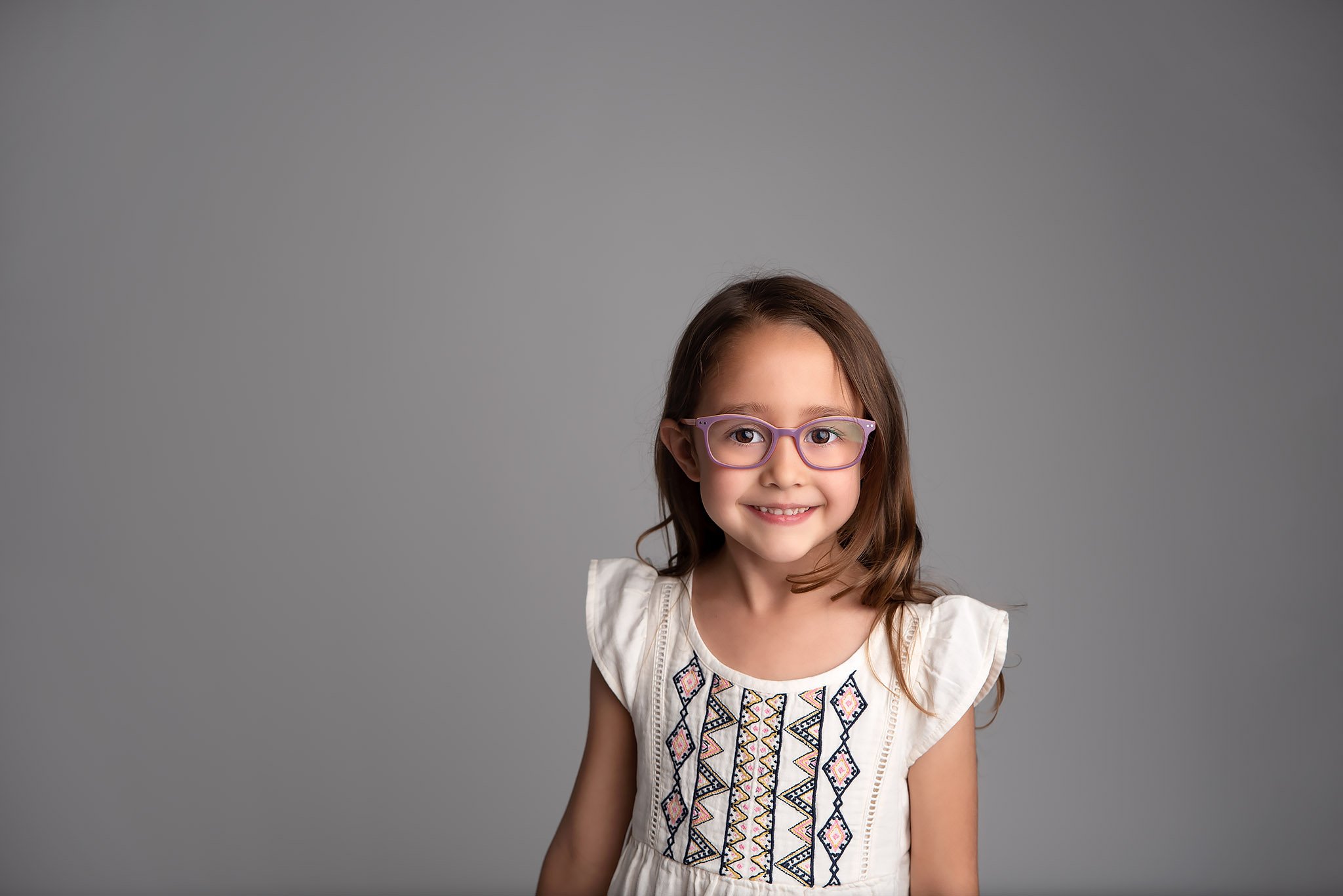 little-girl-wearing-purple-glasses.jpg