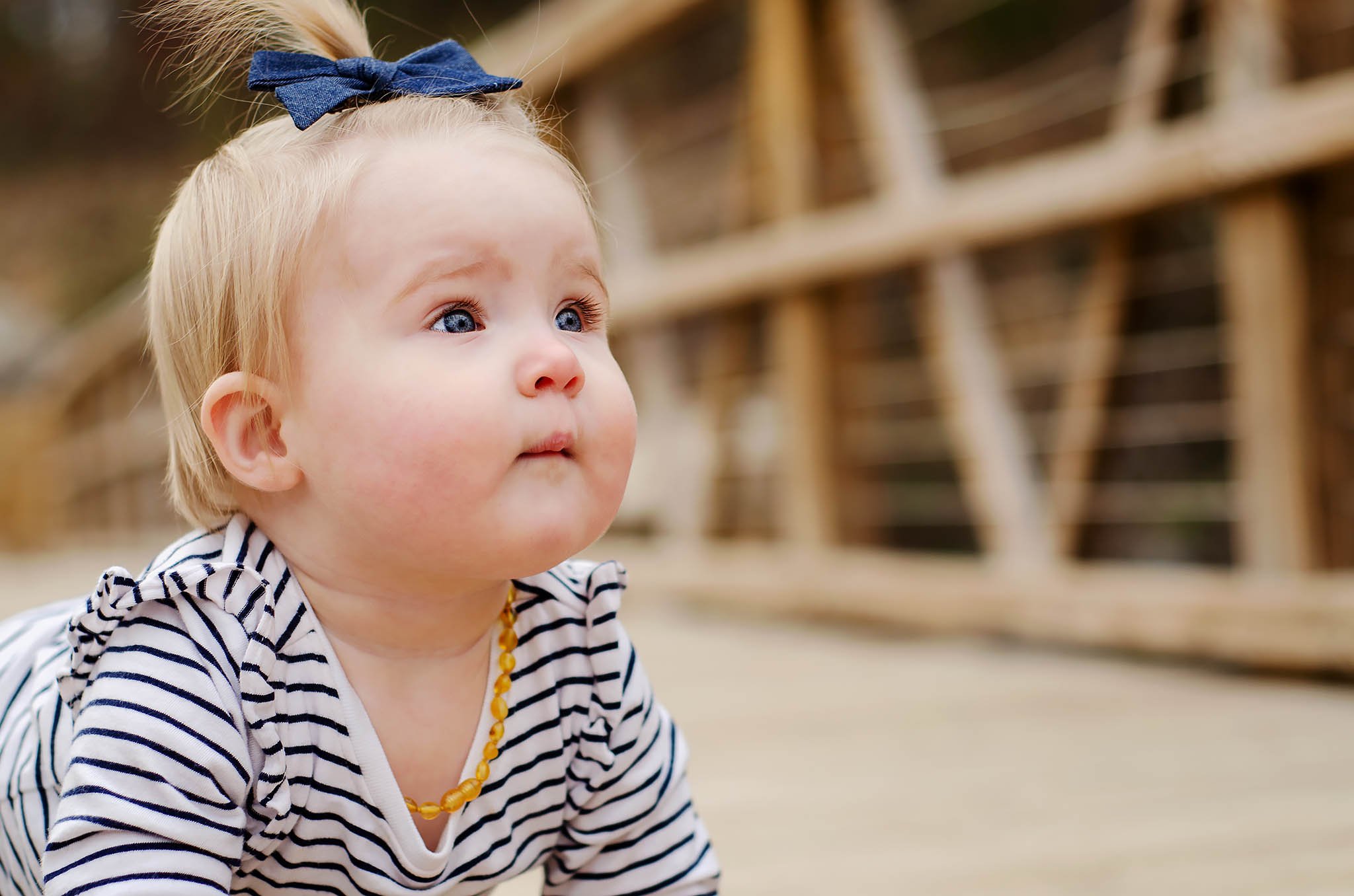 baby-wearing-striped-shirt-and-teething-necklace.jpg