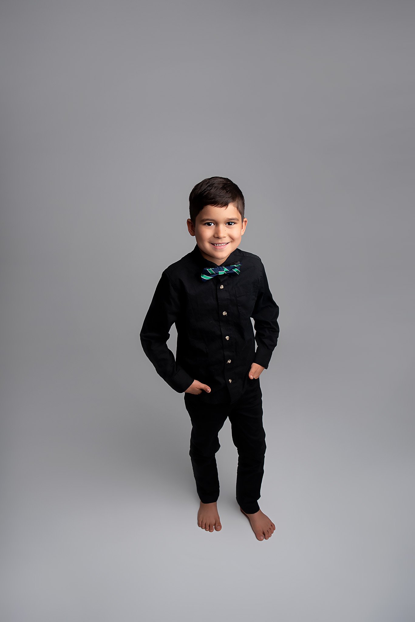 little-boy-wearing-black-outfit-and-bow-tie.jpg