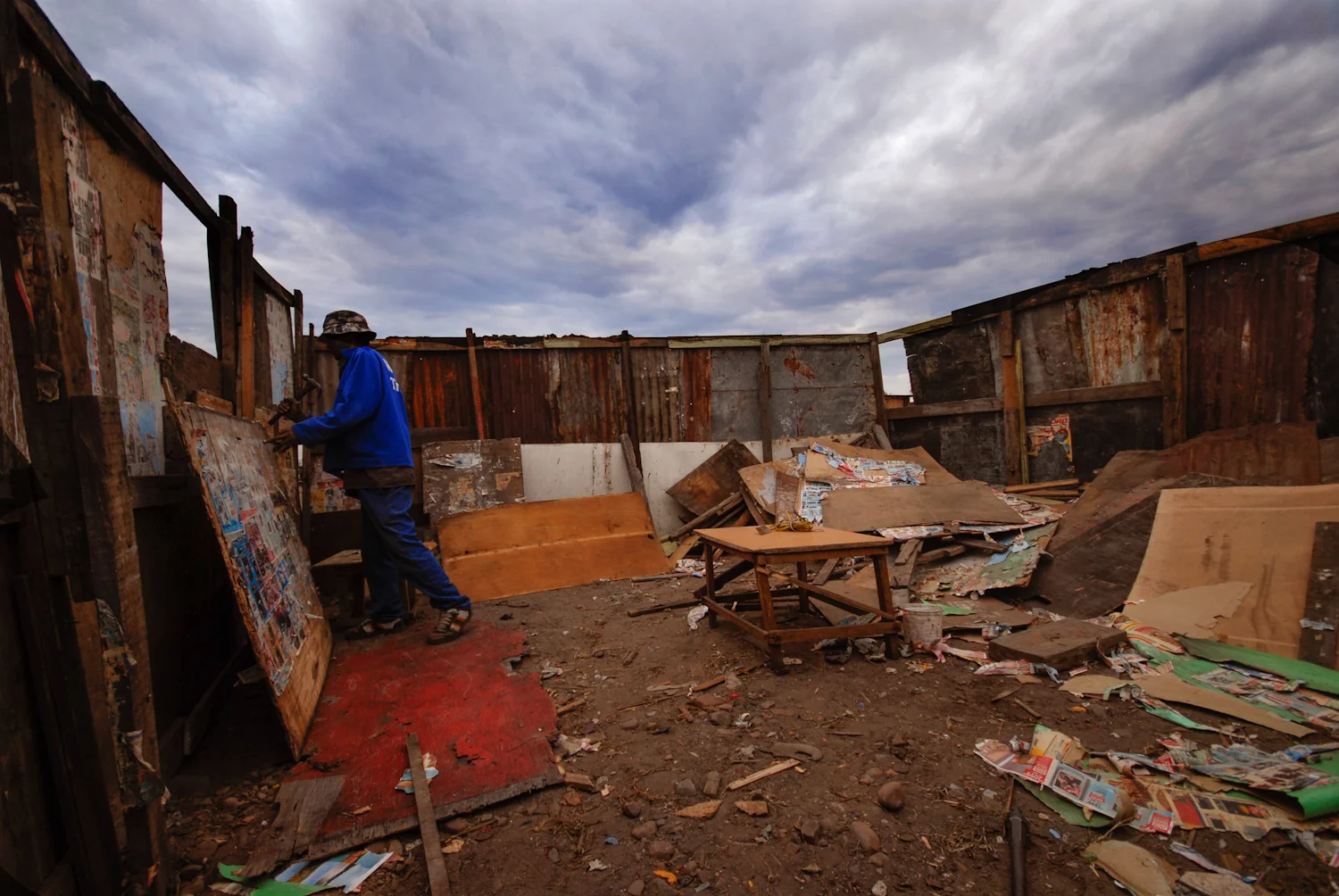 The rebuilding begins while heavy rain clouds threaten